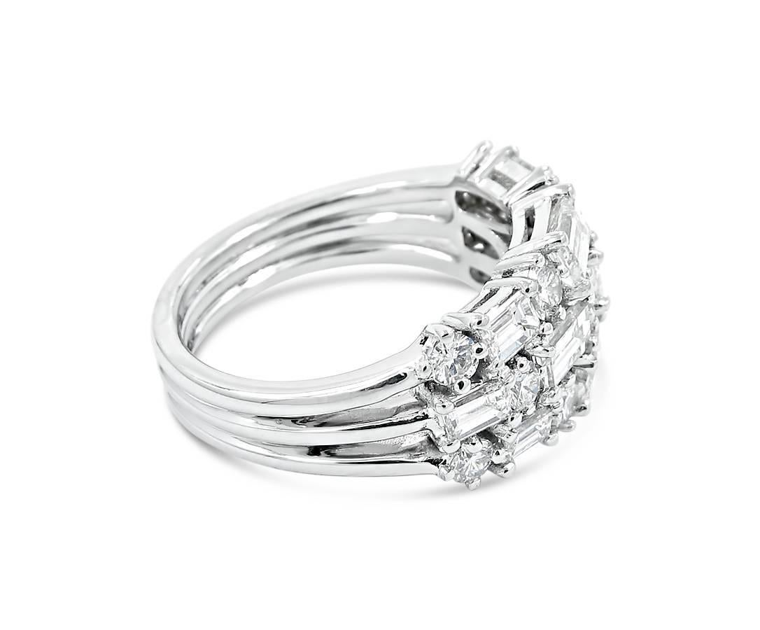 18k white gold ladies cluster style three row ring with alternating shared prong set baguette and round diamonds. Baguettes equal 2ctw, round diamonds equal .80ctw giving this ring a total carat weight of 2.80cts with color ranging from F-G and VS
