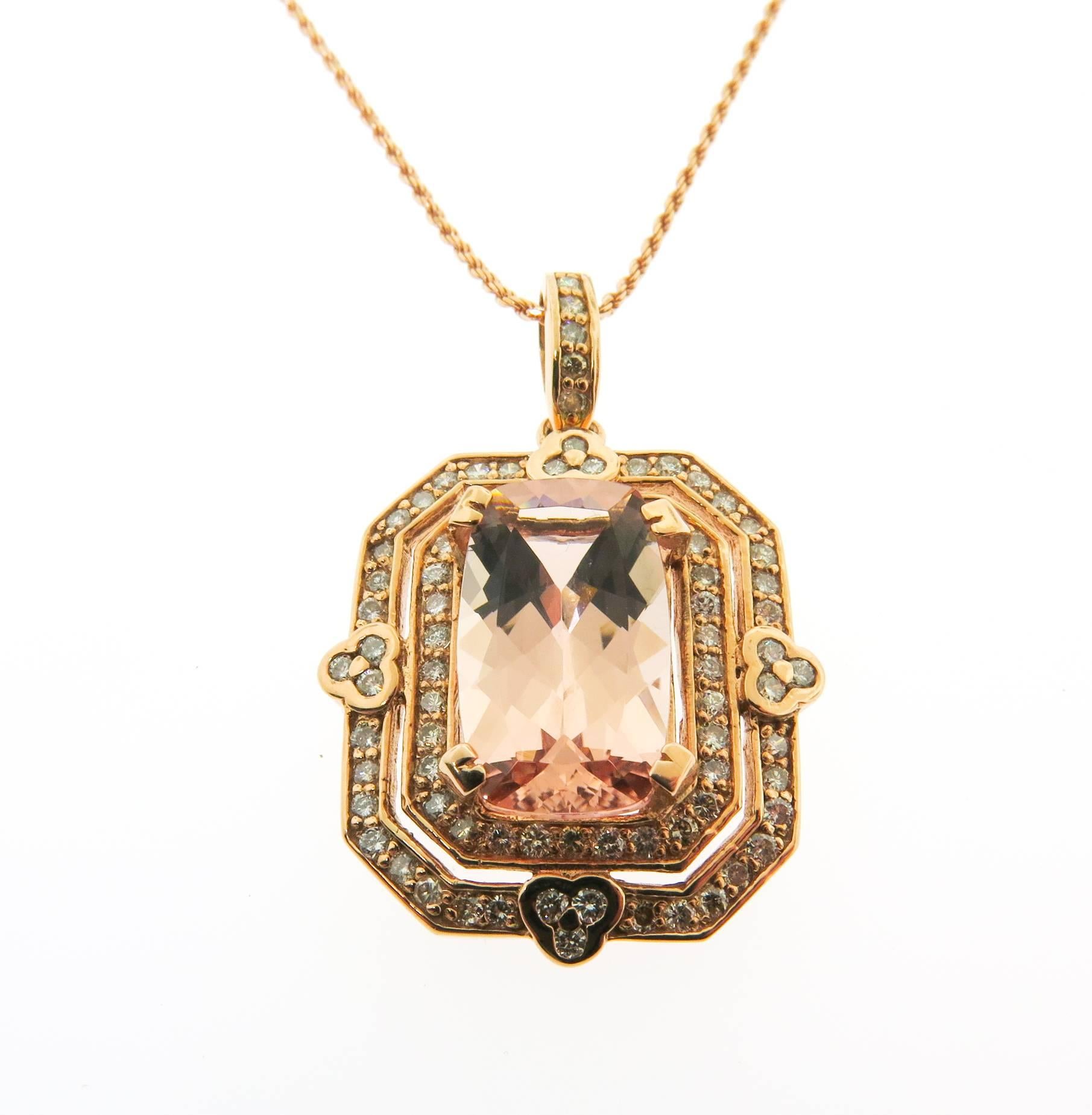 This custom made pendant features a 7.54 ct. emerald cut Morganite which is surrounded by two rows of round brilliant cut diamonds weighing 1.37 carats. The diamonds are I/SI1 in quality and bead set in a double halo style pendant with a diamond