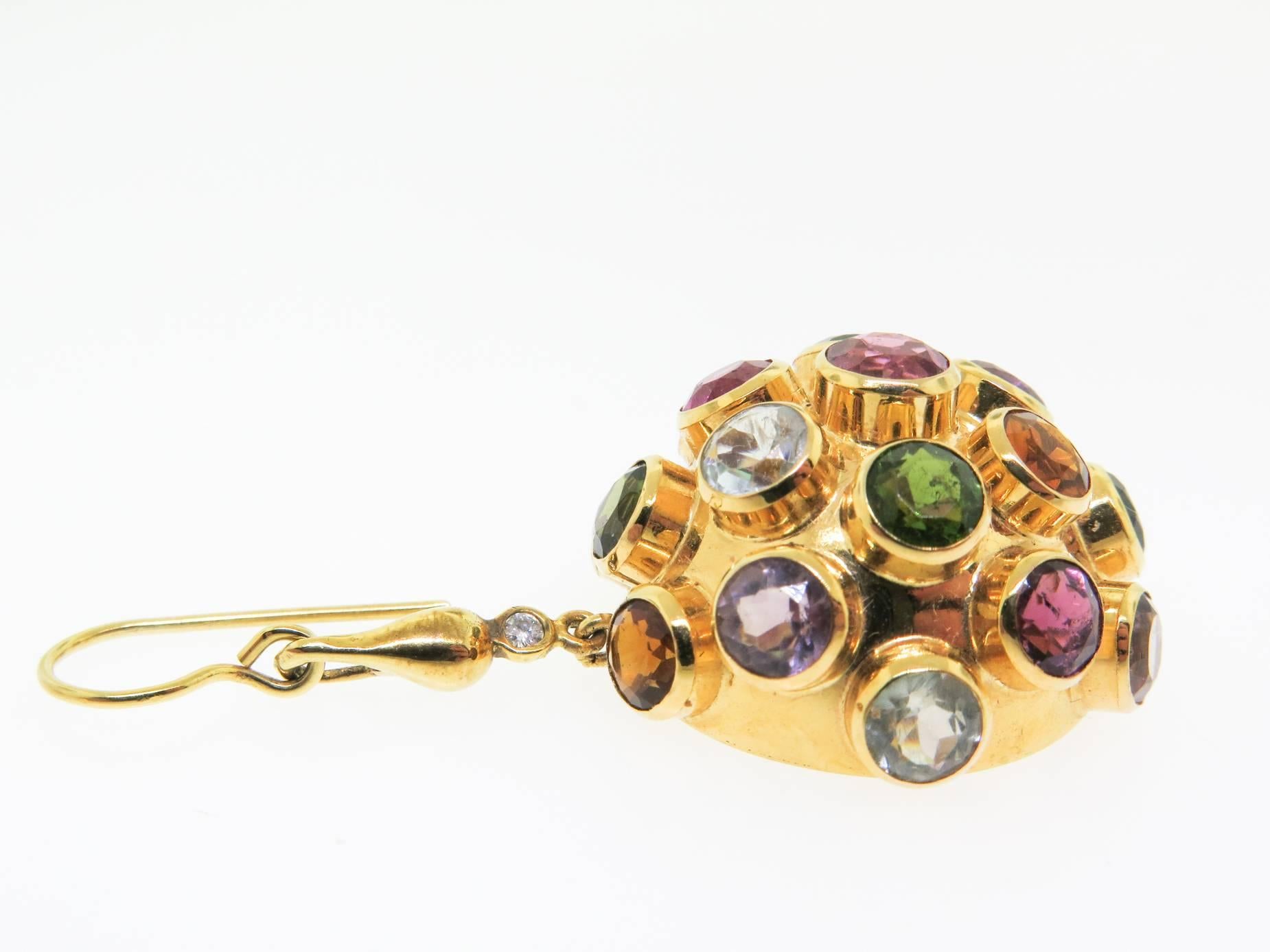 A magnificent pair of earrings featuring multicolor gemstones adorned with round brilliant cut diamonds on the top of the half round drop. For a dash of color and class, wear Amethyst, Green and Pink Tourmaline, Peridot, Citrine and Blue Zircon in