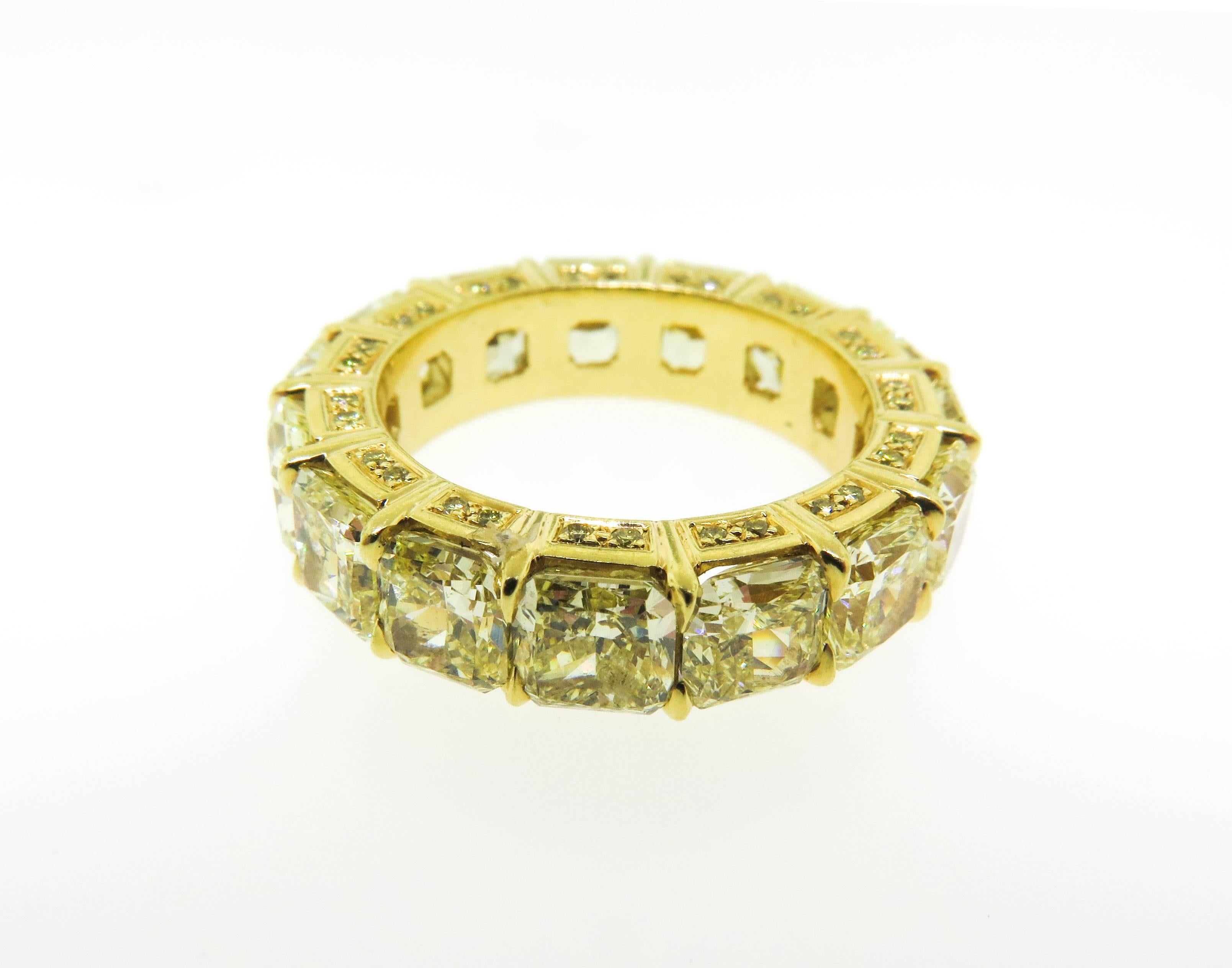 Beautifully hand crafted 18KT yellow gold eternity band set with 8.63 carats of Fancy Yellow Radiant Cut Diamonds. To add more brilliance the ring is accented with 0.28 carats of Round Brilliant Cut Diamonds. Yes, it is a splendorous!
 