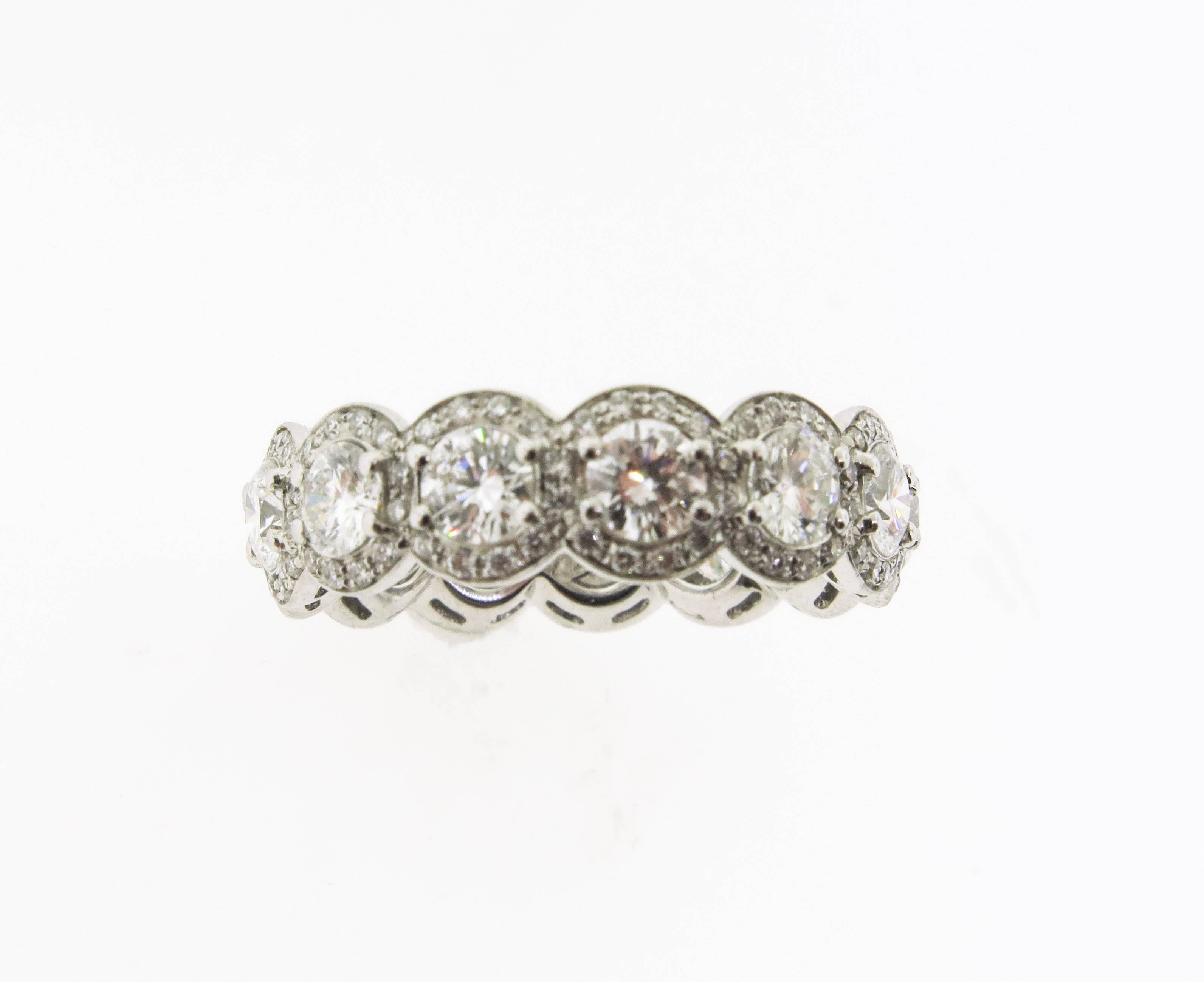 This stunning handmade white gold eternity band has 13 round cut diamonds totaling 2.99 cts. with a G color and SI1 clarity. It is a timeless staple piece of luxury jewelry that every woman will want to wear for an eternity, as it can be worn for