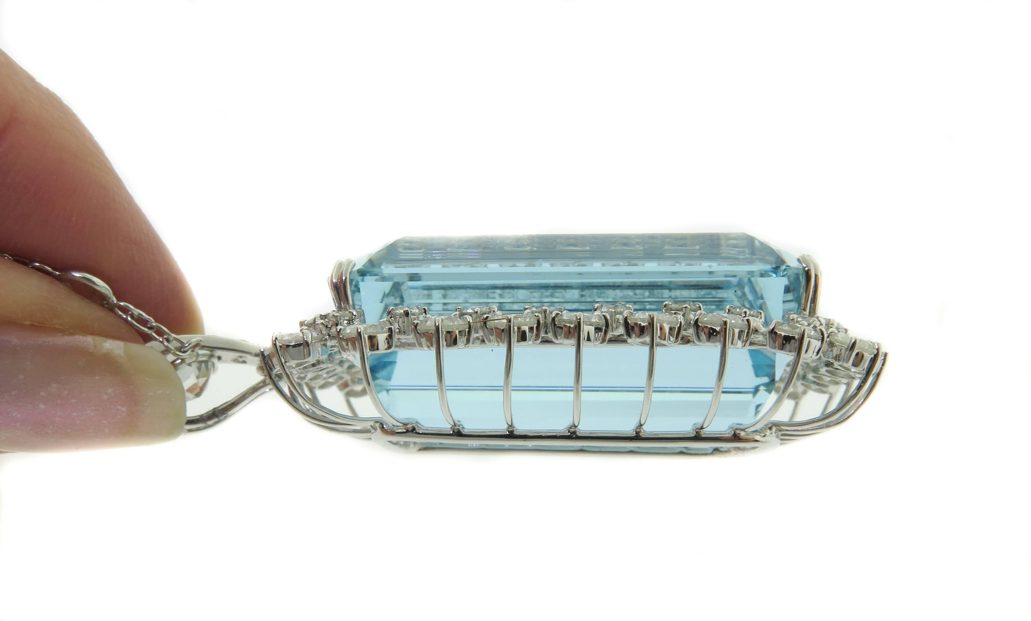 A Stunning Necklace!!  Showcasing a 71.34 carat emerald cut Aquamarine suspended by a double strand Diamonds by the yard style necklace with a total weight of 4.13 carats total weight.
This Aquamarine has a brilliant blue hue and clarity that is