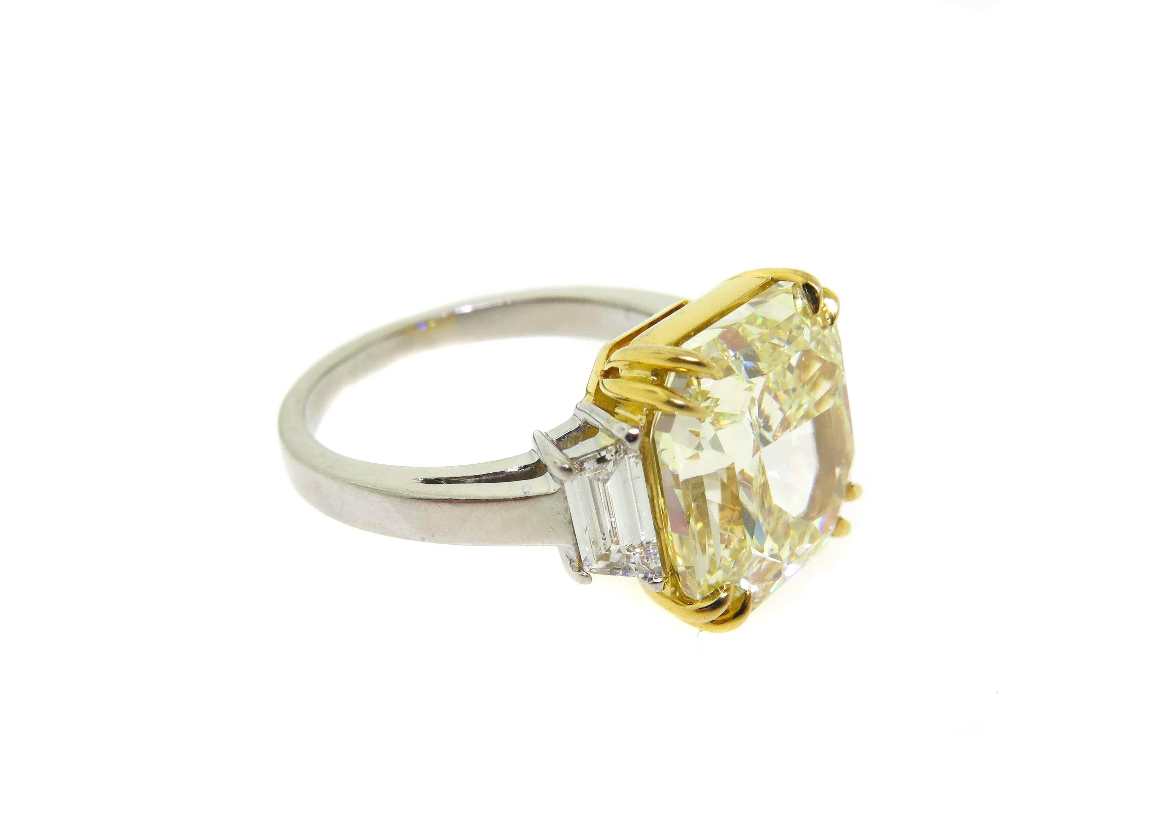 Magnificent 7.41 carat Radiant cut fancy yellow diamond hand set with trapezoids at either side in platinum. This diamond has an amazing yellow brilliance and fire. VS1 clarity GIA certified.
Finger size 6. 