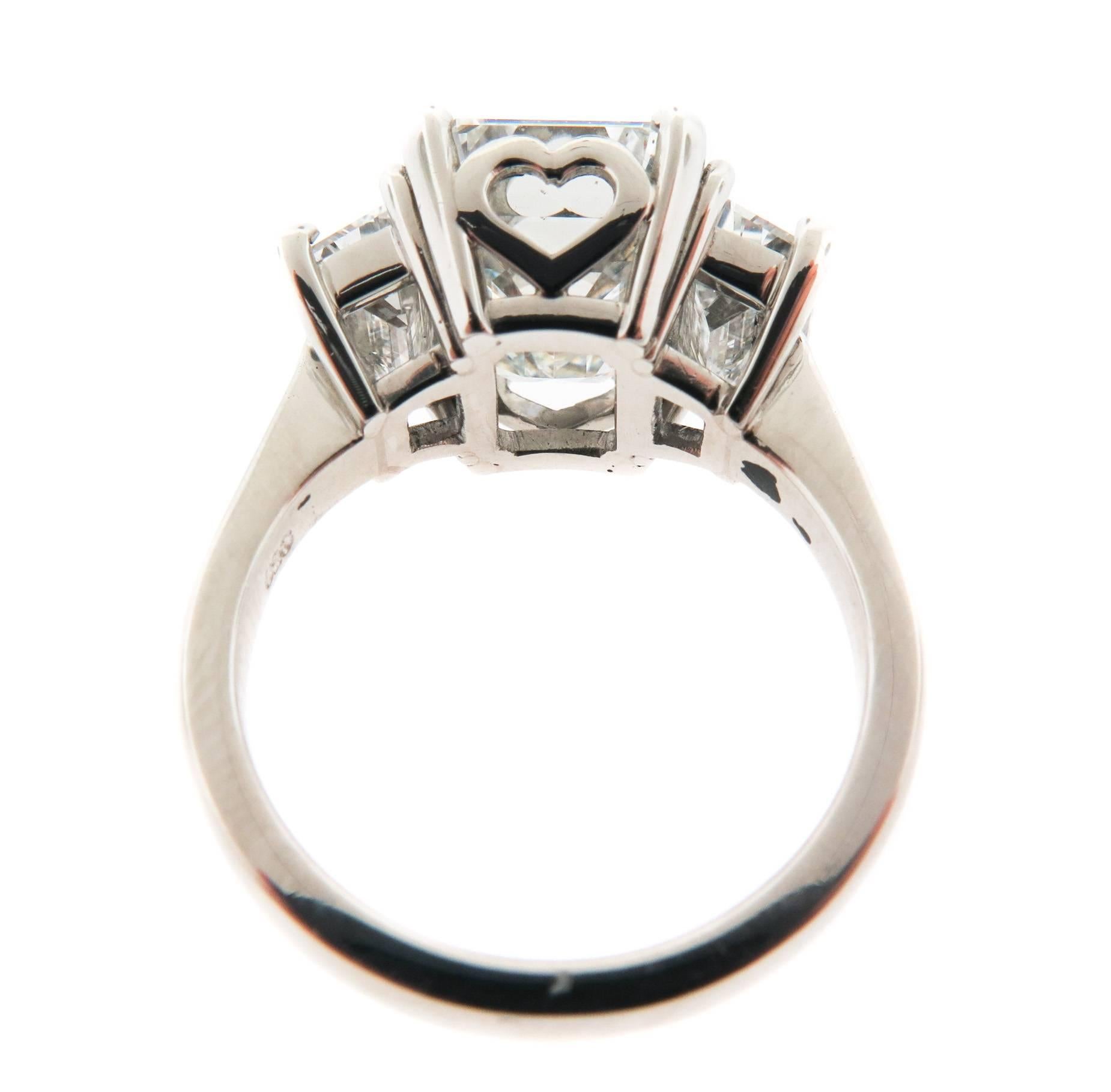 Contemporary GIA Certified 5.47 carats Emerald Cut Diamond and Trapezoids Platinum Ring