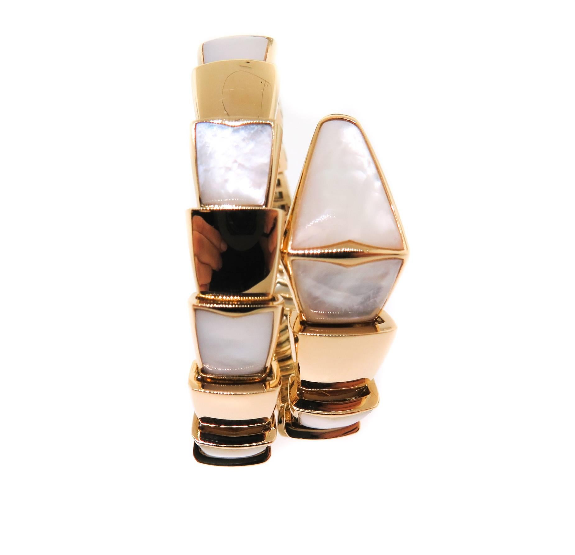 18k Yellow Gold  Bulgari 'Serpenti' wrap around bracelet in 18k yellow gold, designed as a sprung bangle with alternating 'scales' of gold and mother-of-pearl.

Signed Bulgari.