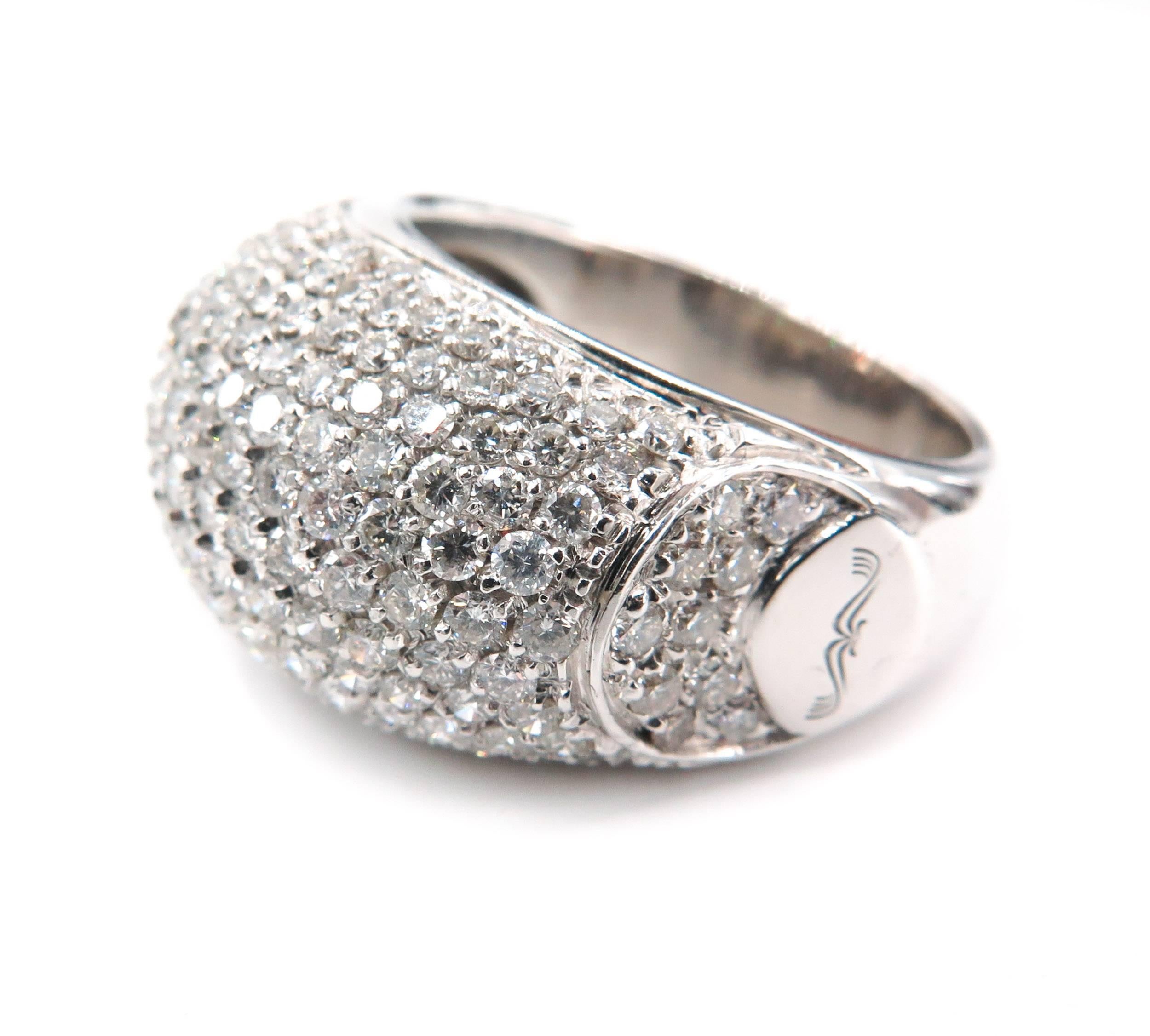 A magnificent cocktail ring featuring a slightly domed design set with the finest round brilliant cut diamonds in 18k white gold.
A real statement ring 14mm wide, 28mm long and 7.5mm high. 
Handcrafted in 18 karat white gold with pave set diamonds