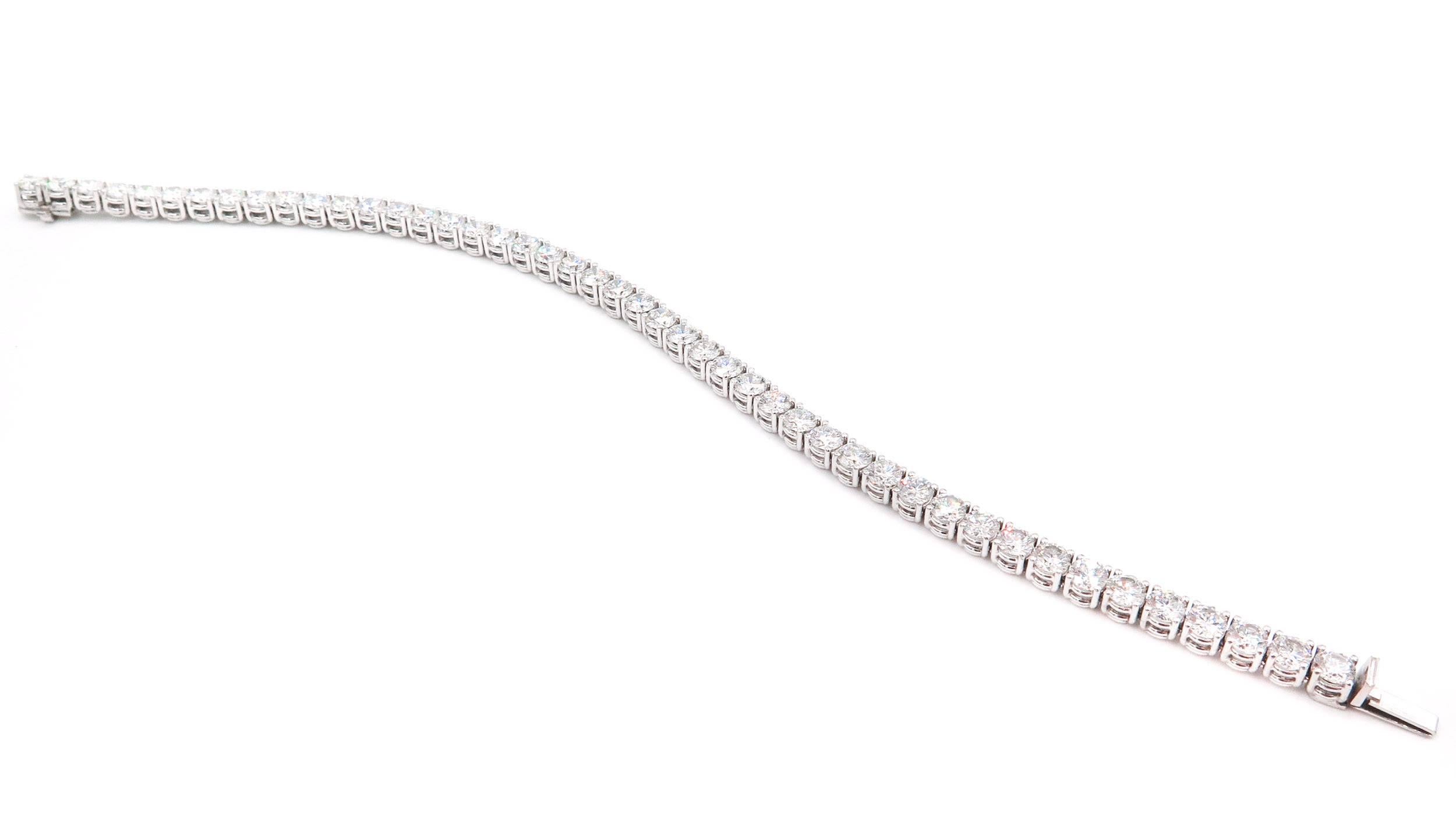 Simply classic! This diamond tennis bracelet features 46 round brilliant cut diamonds with a total weight of 8.86 carats, prong set in platinum. The bracelet has a hidden clasp with safety. A phenomenal Bracelet designed by the legendary Asprey of