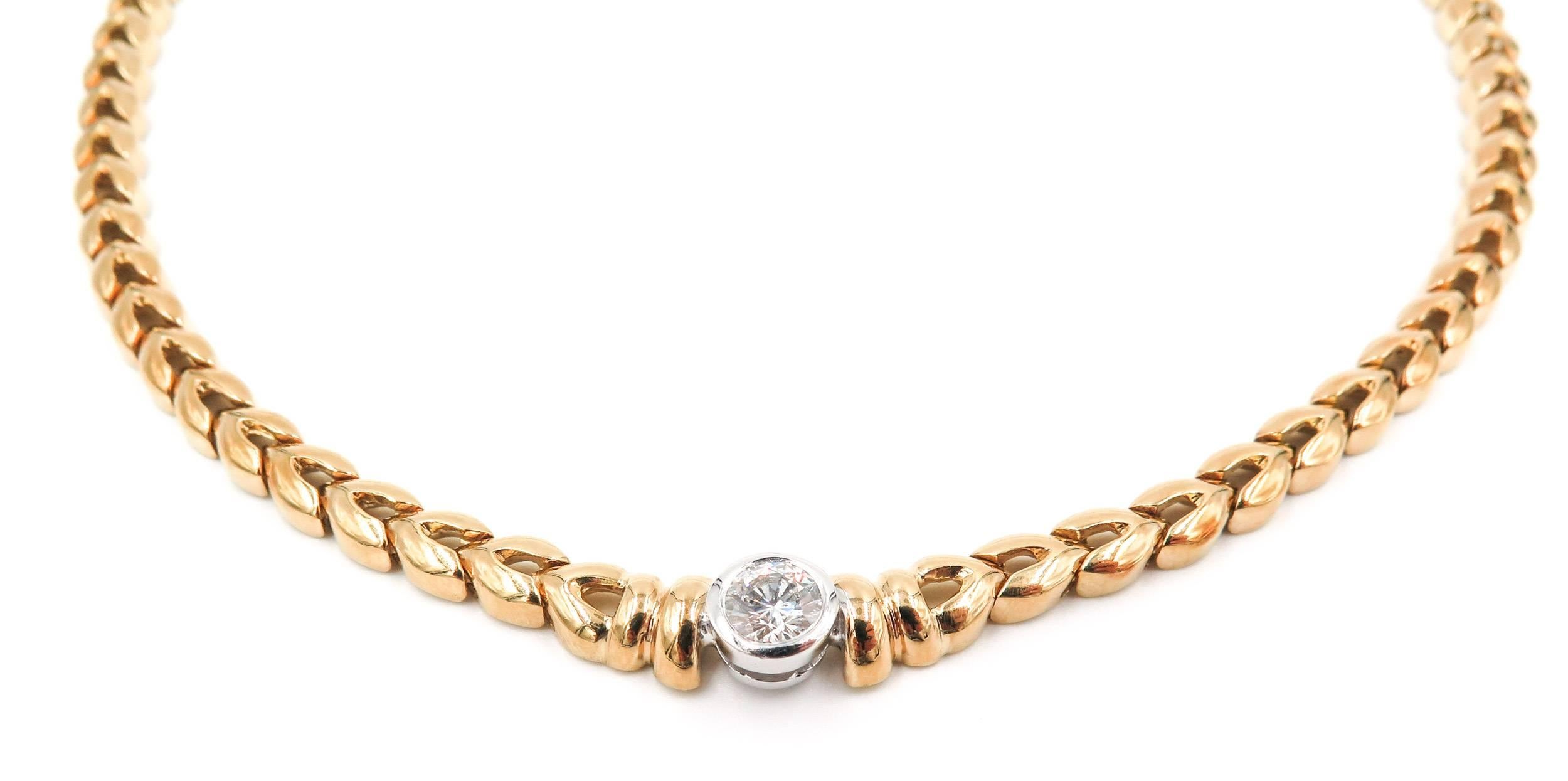 This exquisite necklace is crafted in 18k yellow gold and features a sparkling brilliant cut diamond set in a white gold bezel weighing approximately 0.90 carat total weight, G color, SI1 clarity.
A classic and elegant design for everyday wear,