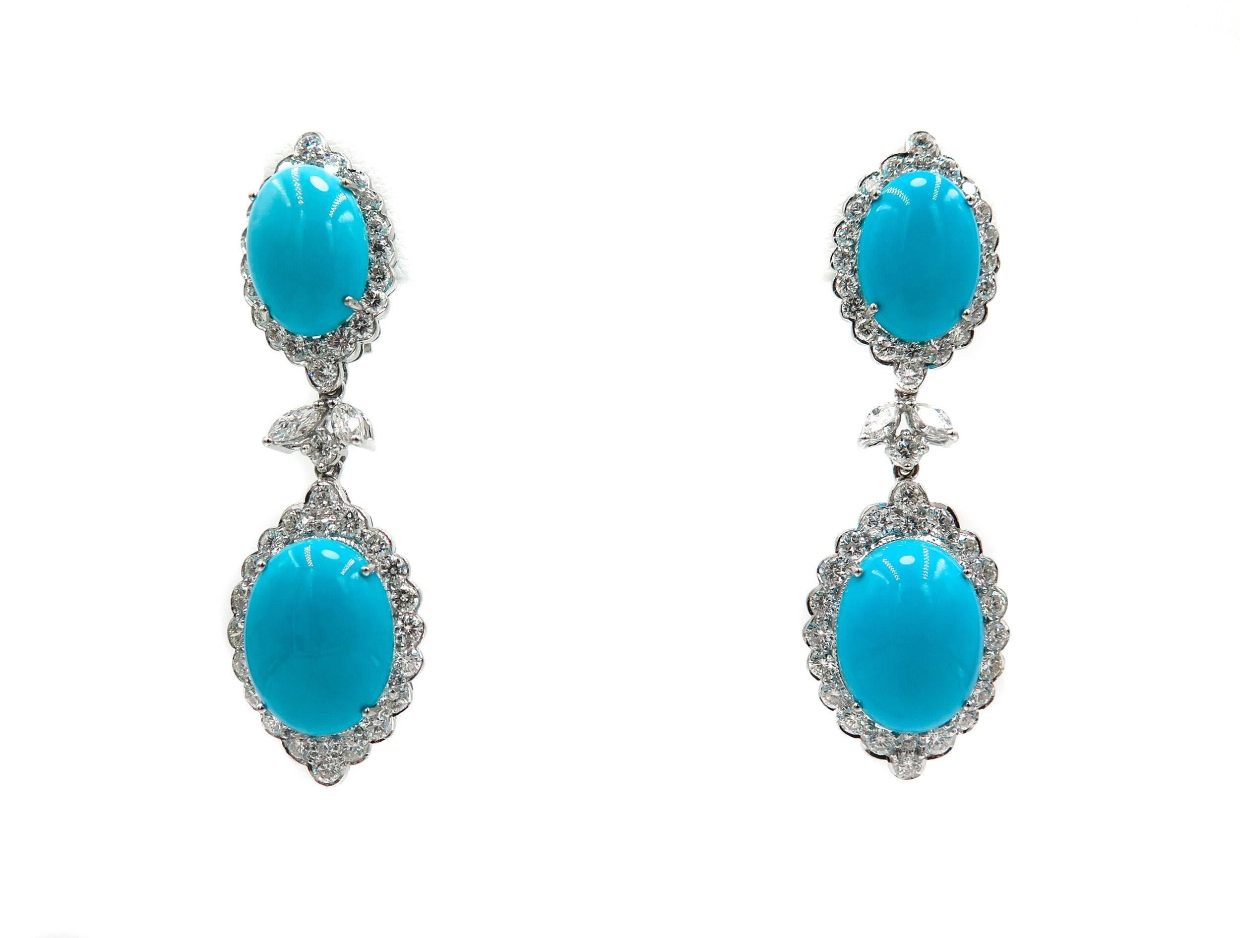 Absolutely stunning!!! Elegant Turquoise and Diamond Earrings.
Each Oval Turquoise is surrounded by a Halo of White Diamonds.  Approximately 2.5 inches long, 22.33 carats of Natural Turquoise and fine white diamonds, both round and marquise cut,
