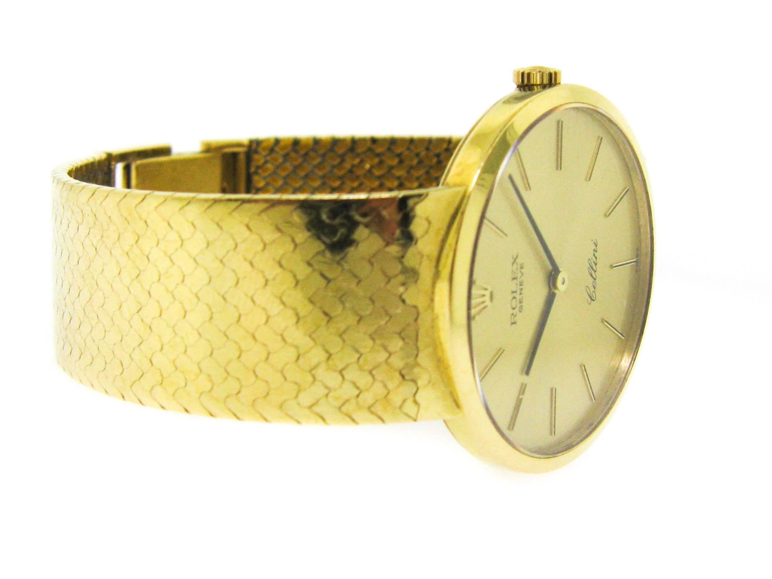 Rolex Cellini crafted in 18K Yellow Gold case 32mm and 7 inches long 18K Yellow Gold mesh Bracelet.  This timepiece features a manually wound movement with indications for the Hours and Minutes.  We have the timepiece only, no box or papers.