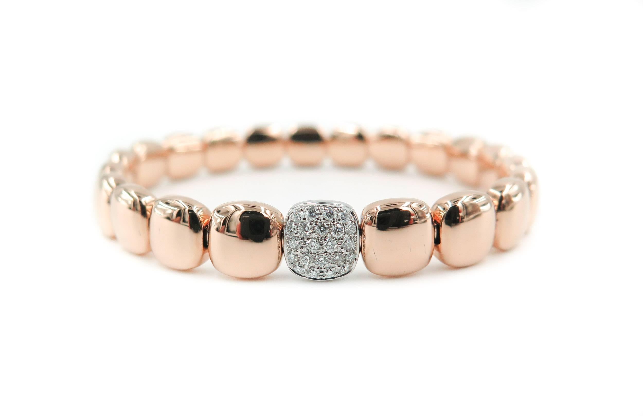 This graceful 18k rose gold cushion shaped beaded bracelet, handcrafted in Italy featuring 20 sparkling round cut white diamonds set in the center bead. Bracelet is constructed with a unique stainless steel coil mechanism that allows the bracelet to