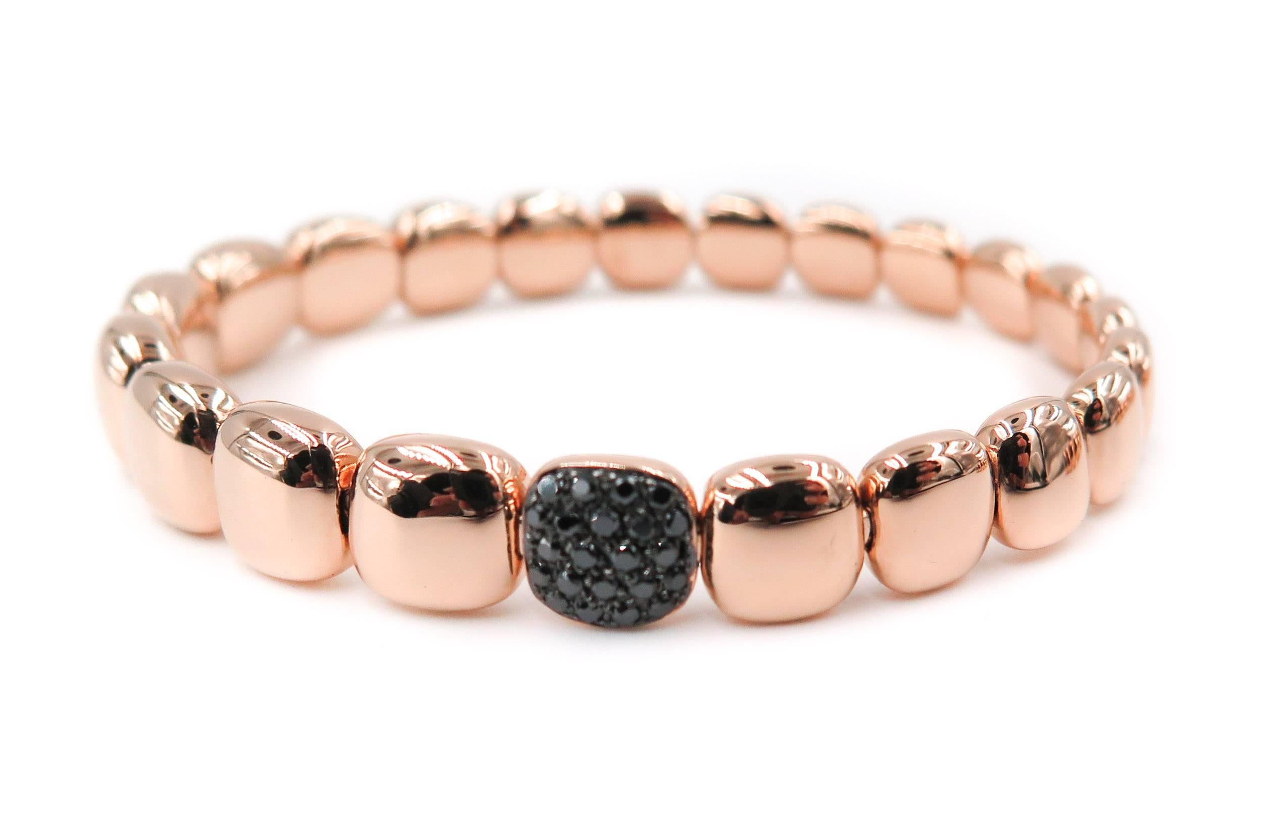 This graceful 18k rose gold cushion shaped beads bracelet, handcrafted in Italy featuring 20 sparkling round black diamonds set in the center bead. Bracelet is constructed with a unique stainless steel coil mechanism that allows the bracelet to