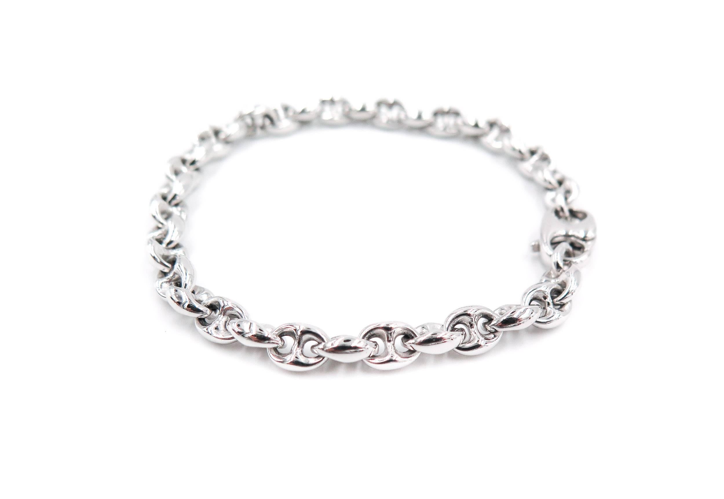  Beautifully designed solid 18K white gold marine link bracelet with same style clasp. 
The bracelet is 7.25 inches long and weight 22.20 grams.