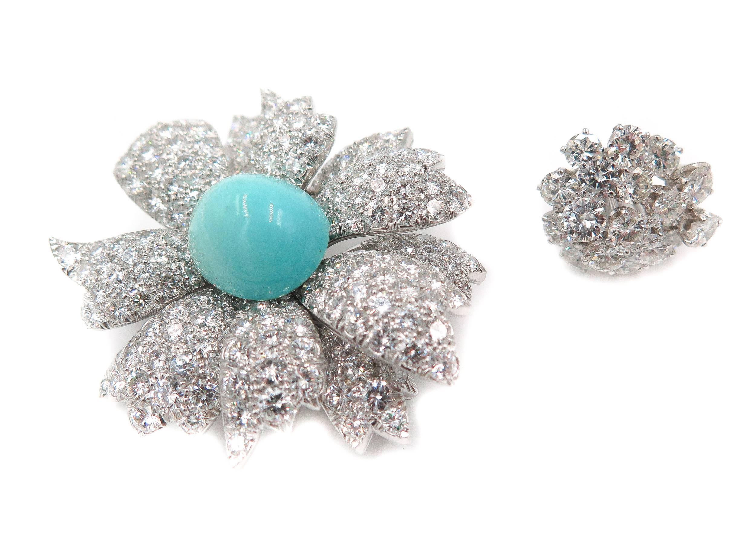 This stunning diamond and turquoise brooch is just the bauble to brighten up your wardrobe. 
With an interchangeable centerpiece, this brooch can go from diamond to turquoise in a quick twist! 
An impeccable cluster of diamonds make up this diamond