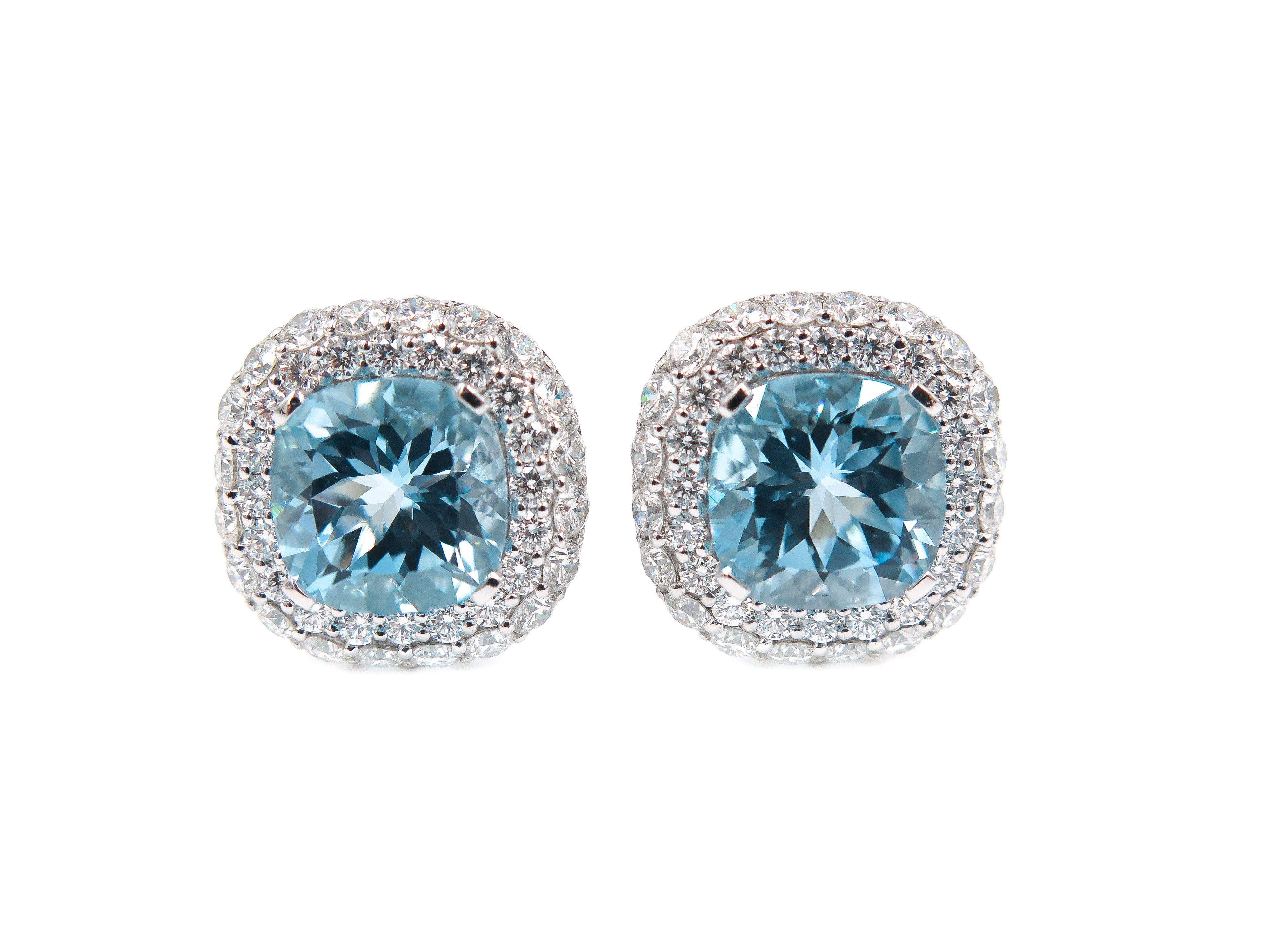 Designed by Leo Pizzo and entirely handmade by experienced master craftsman this pair of Blue Topaz and Diamond Earrings are stunningly beautiful!!
The 18K white gold enhances the brilliance of the 3.21 carats of white diamonds set around the
