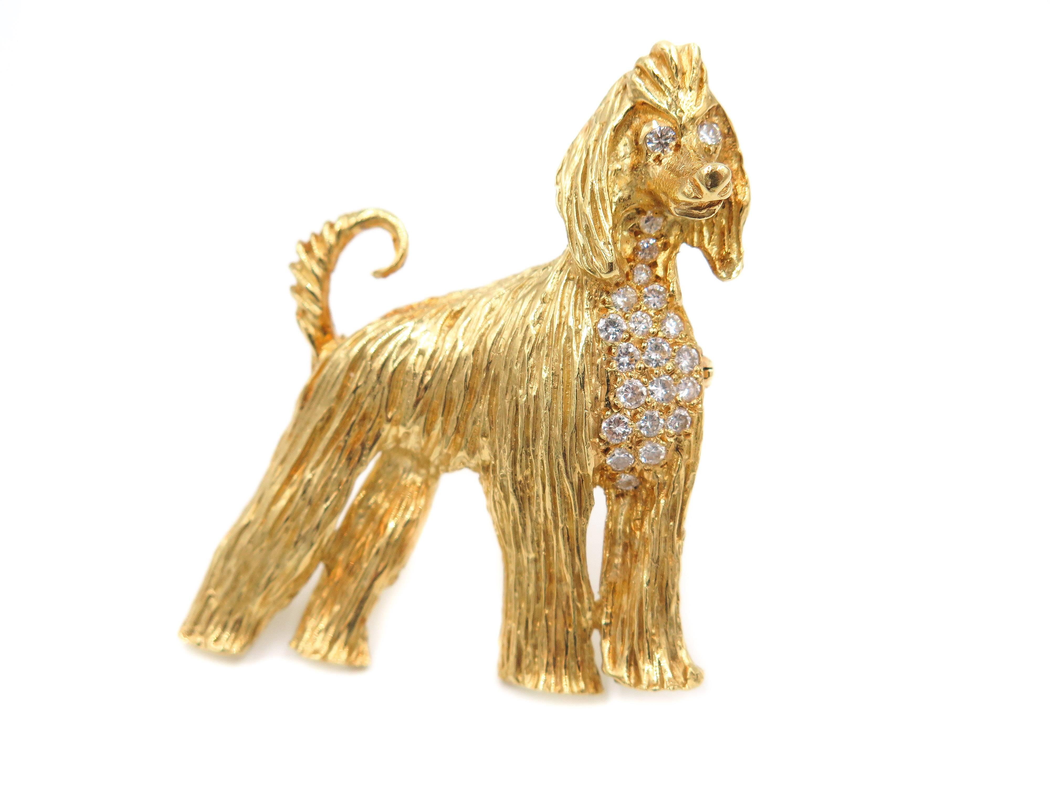 Since ancient times, Afghan Hounds have been famous for their elegant beauty and thick flowing coat as the breed's crowning glory ...accented by white brilliant diamonds this gorgeous brooch is handcrafted in 18k yellow gold.
