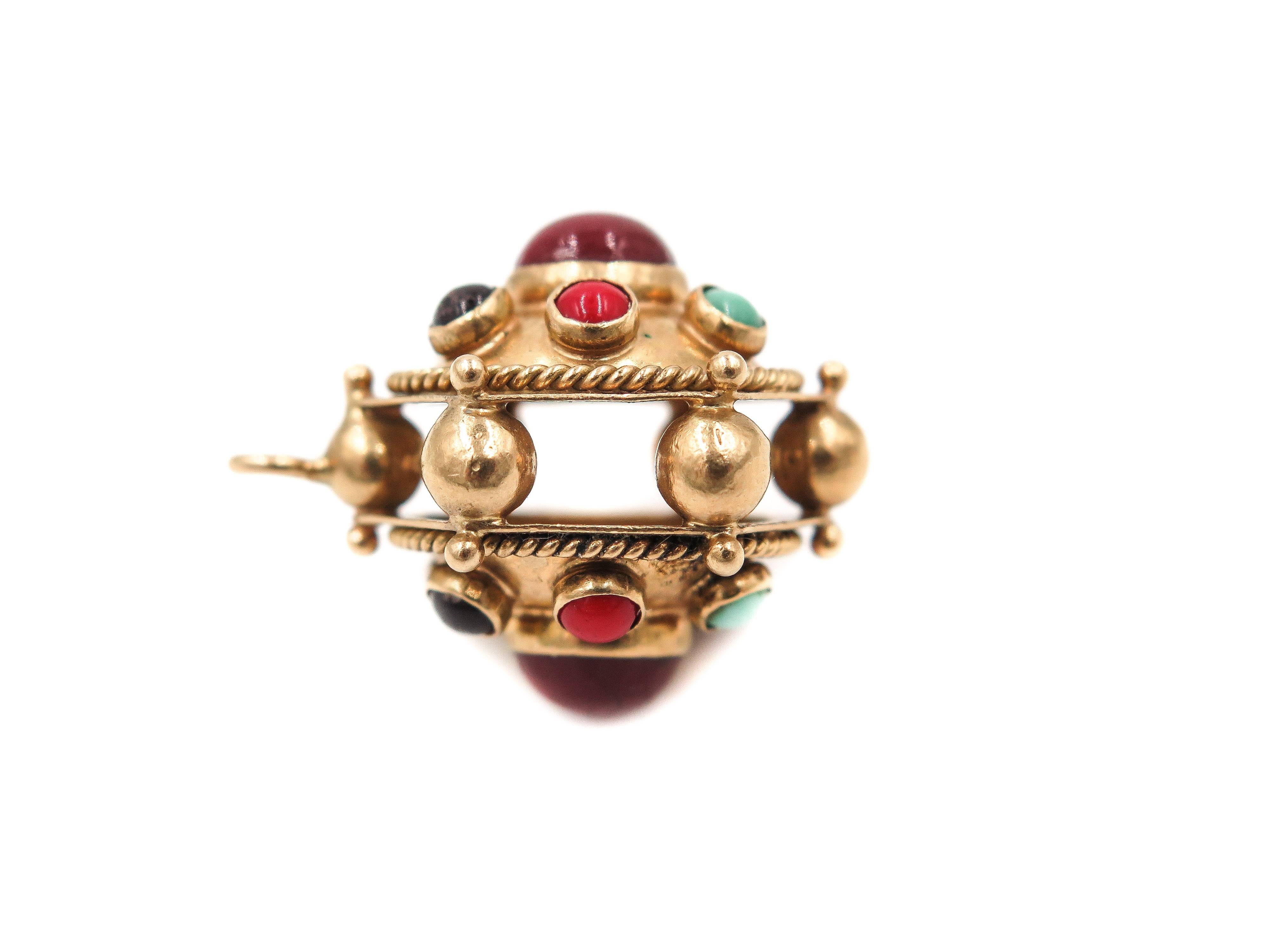 This beautiful etruscan style vintage charm is comprised of multiple cabochon cut stones like: Turquoise, coral, amethyst and carnelians.
Artistically crafted in 18k yellow gold, this charm will compliment beautifully your existing collection of