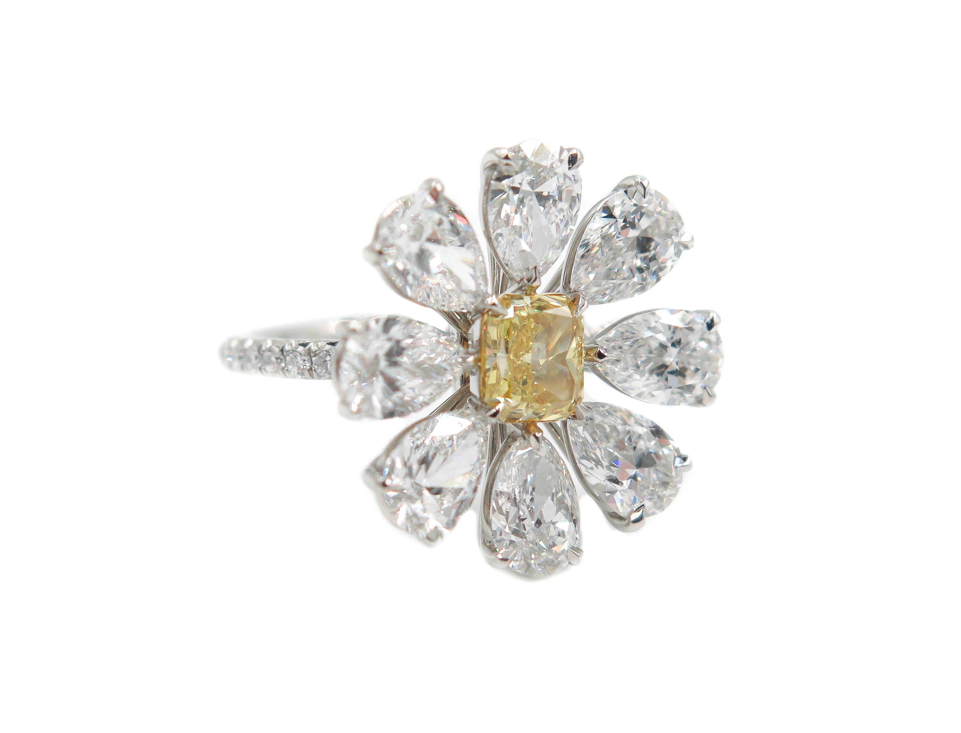 Flowers are known for its grace and delicacy, and can express the most intense feelings.
Inspired by their beauty we created this amazing ring using 8 pear shaped diamonds in D color and VVS1/2 in clarity. 
Centered with a 0.72 carat radiant cut,