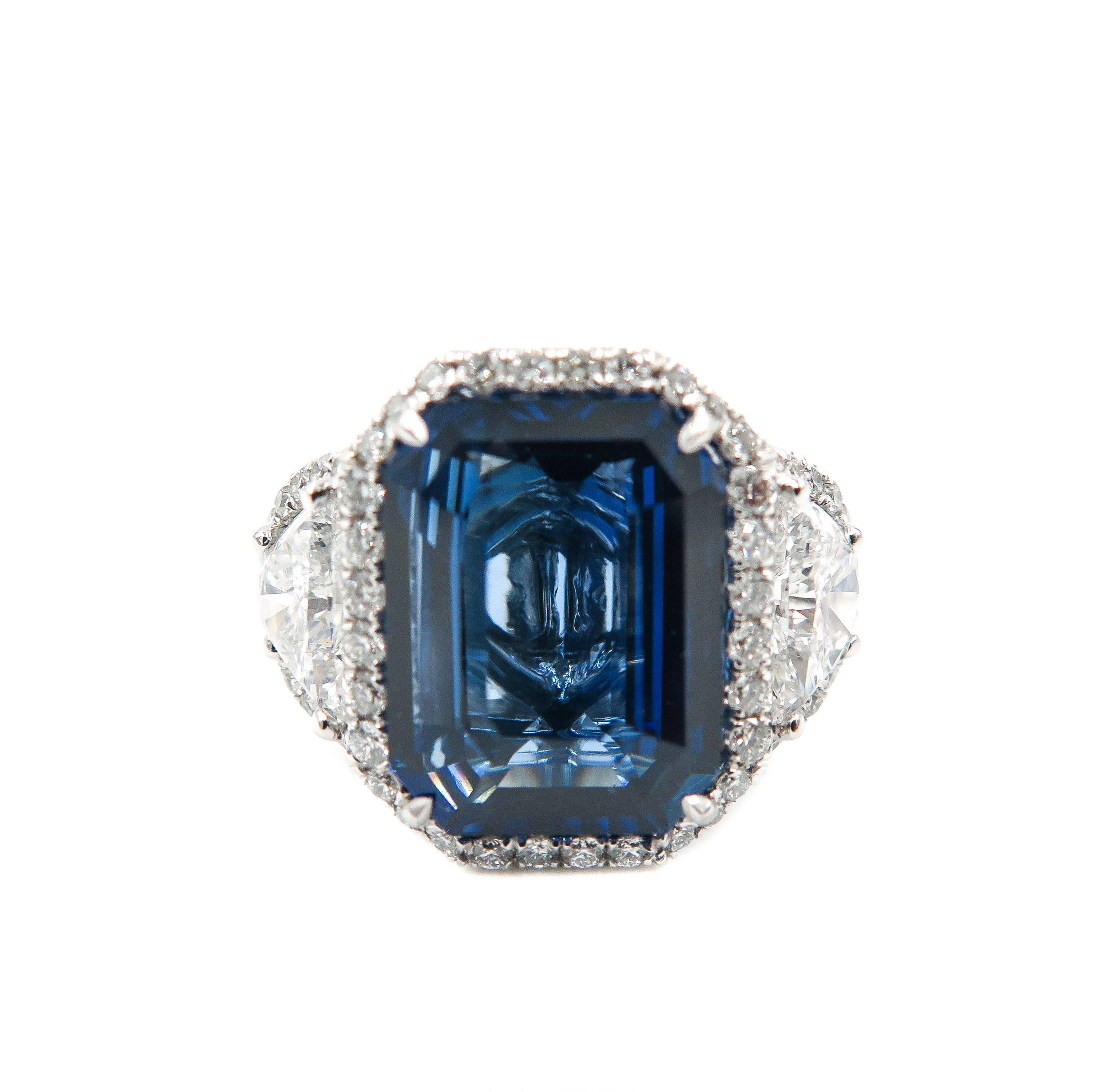 This exquisite masterpiece is designed for the modern woman who aspires to create her own story with this amazing emerald cut unheated Ceylon Sapphire.
GRS certified from Sri Lanka, this sapphire weighs 6.08 carats, and is flanked by 2 half-moon