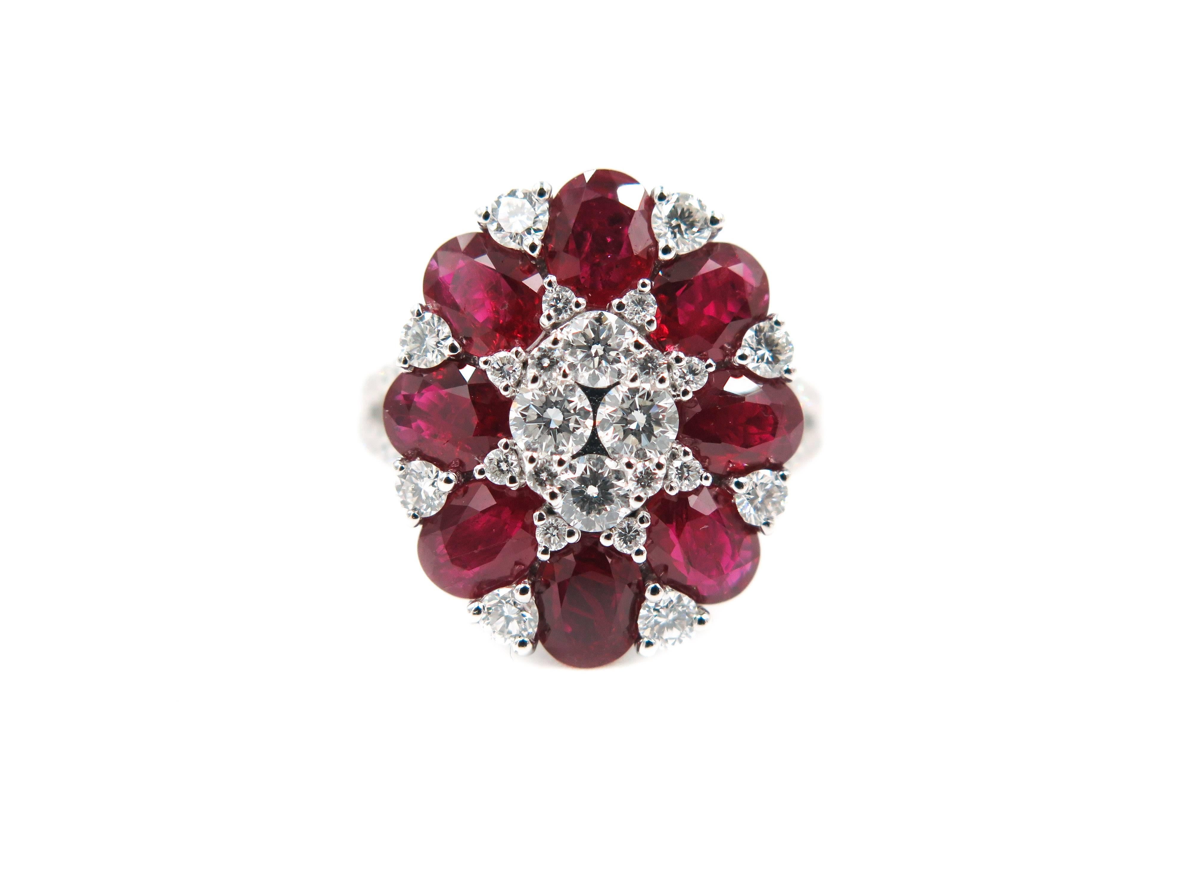 When words are not enough... colors and shapes can speak for themselves. 
Eight oval cut rubies, enriched by 52 round diamonds bloom into this beautiful ring.  
Creatively crafted in 18 karat white gold, with 3.59 carats of ruby and 1.02 carats of