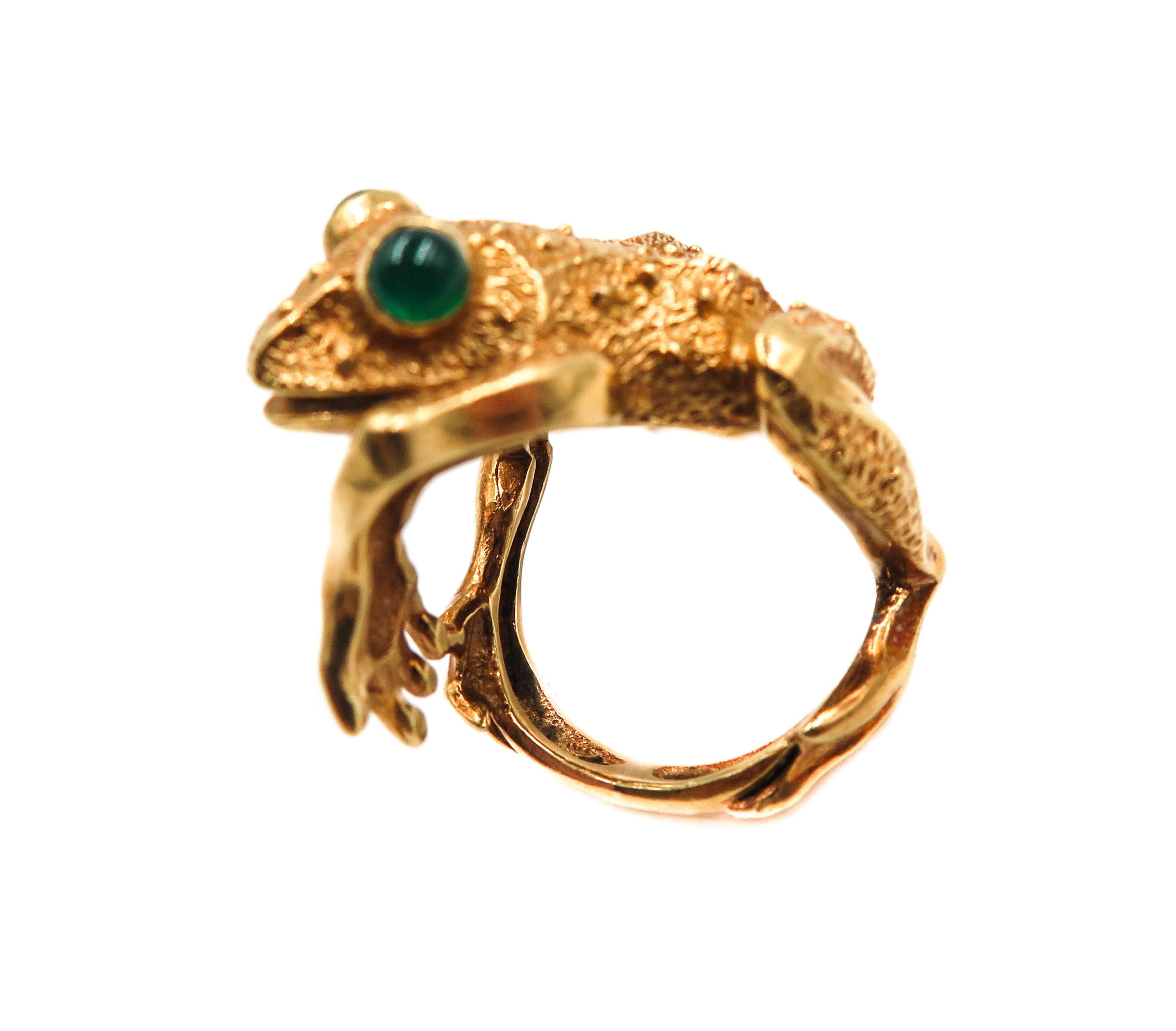 Beautiful Frog Ring by Kurt Wayne. An Austrian jeweler, a true animal lover, model maker and jewelry sculptor.
This Frog ring is crafted in 18K Yellow Gold with a very naturalistic design. The eyes are set with genuine emerald cabochons. 
The frog