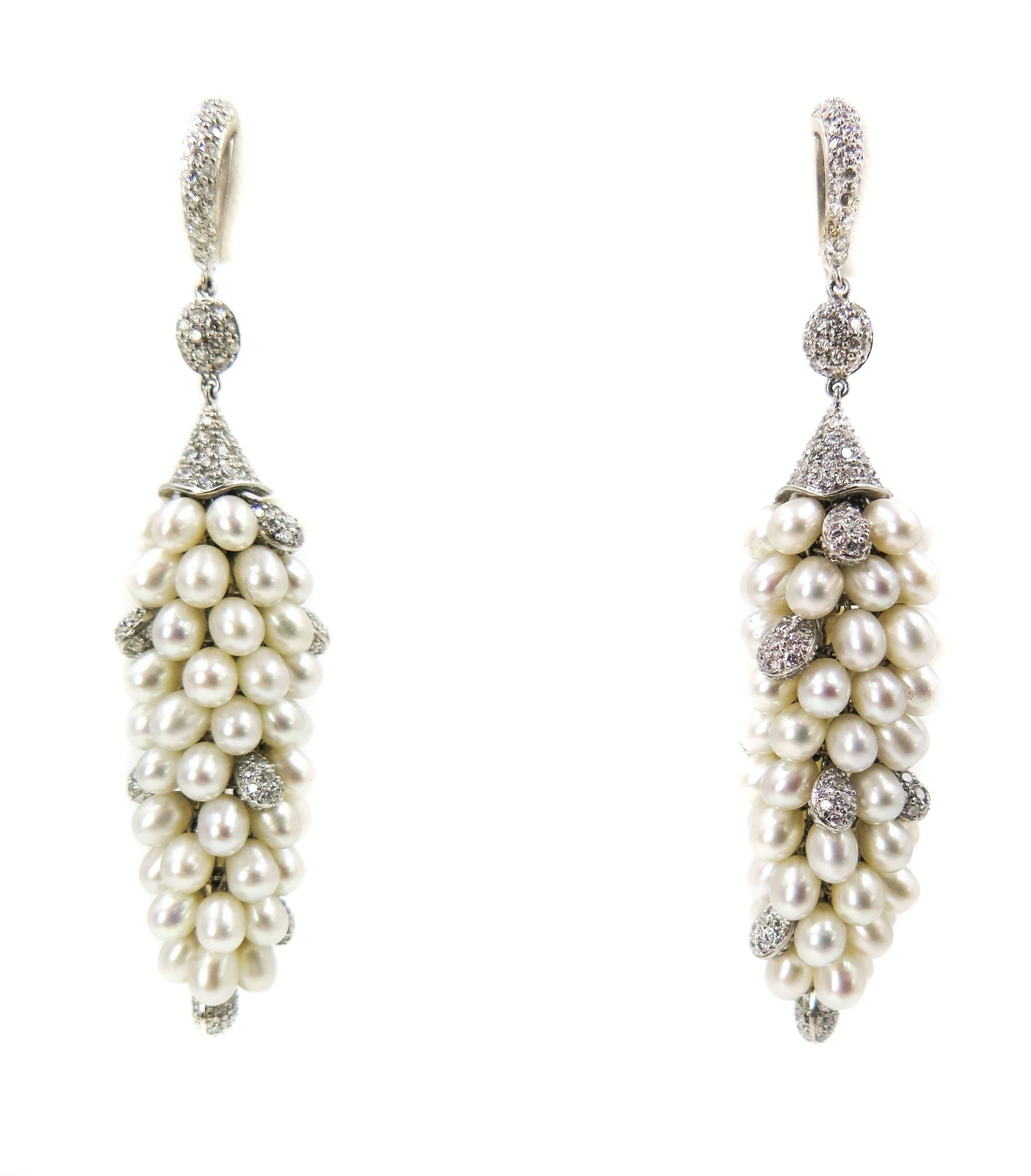 Freshwater pearls add timeless elegance to any jewelry design. 
Perfect for formal occasions and bridal jewelry. Paintings document chandelier earrings like these worn by aristocrats with their gowns of silk and hair upswept. 
The top section of