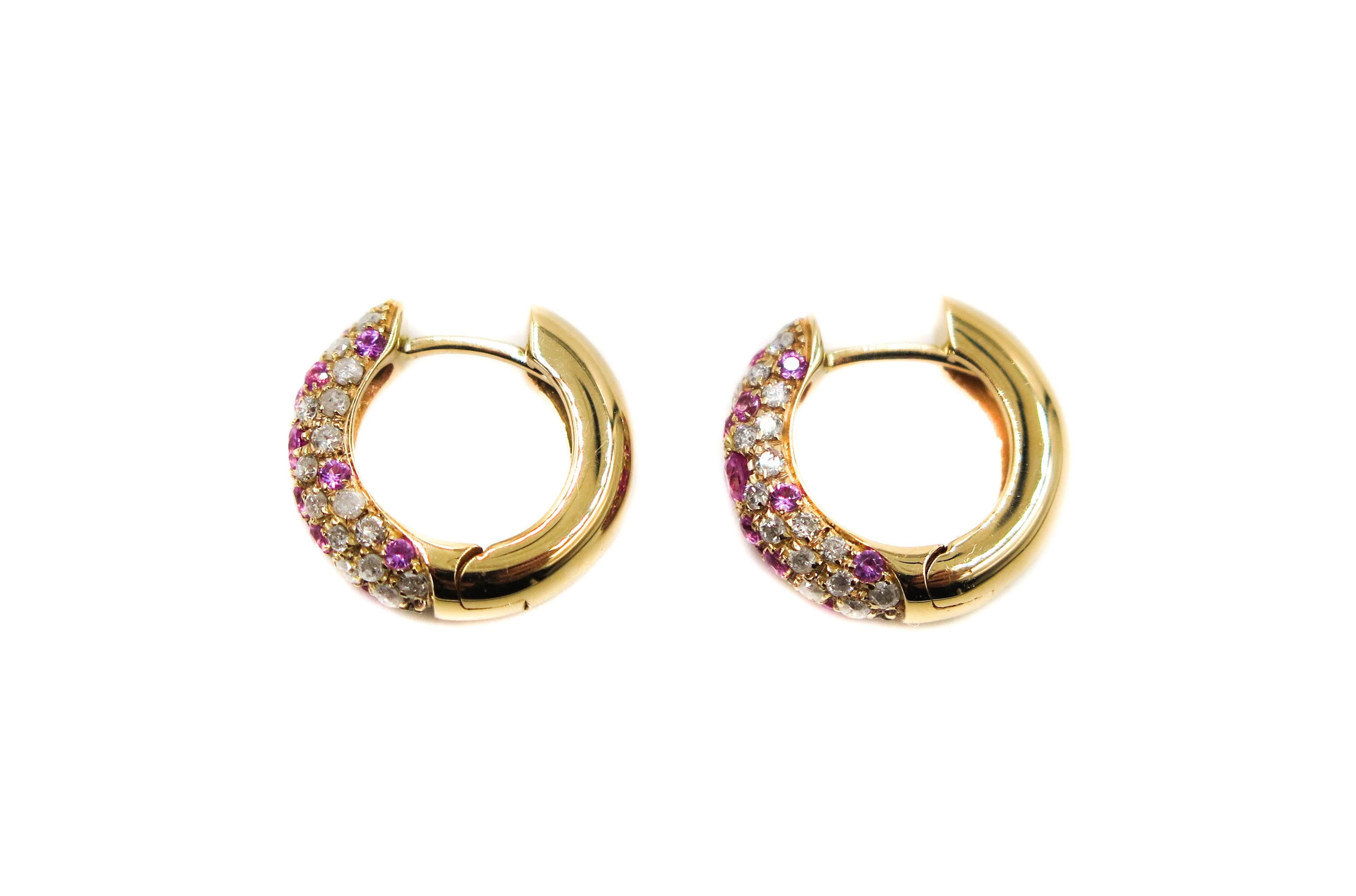 To the fashion connoisseur, having a beautifully handmade piece of jewelry by an Italian designer is owning a very special piece of jewelry.
This pair of huggies showcases the workmanship being featured in a fine pave work.  This confetti of colors