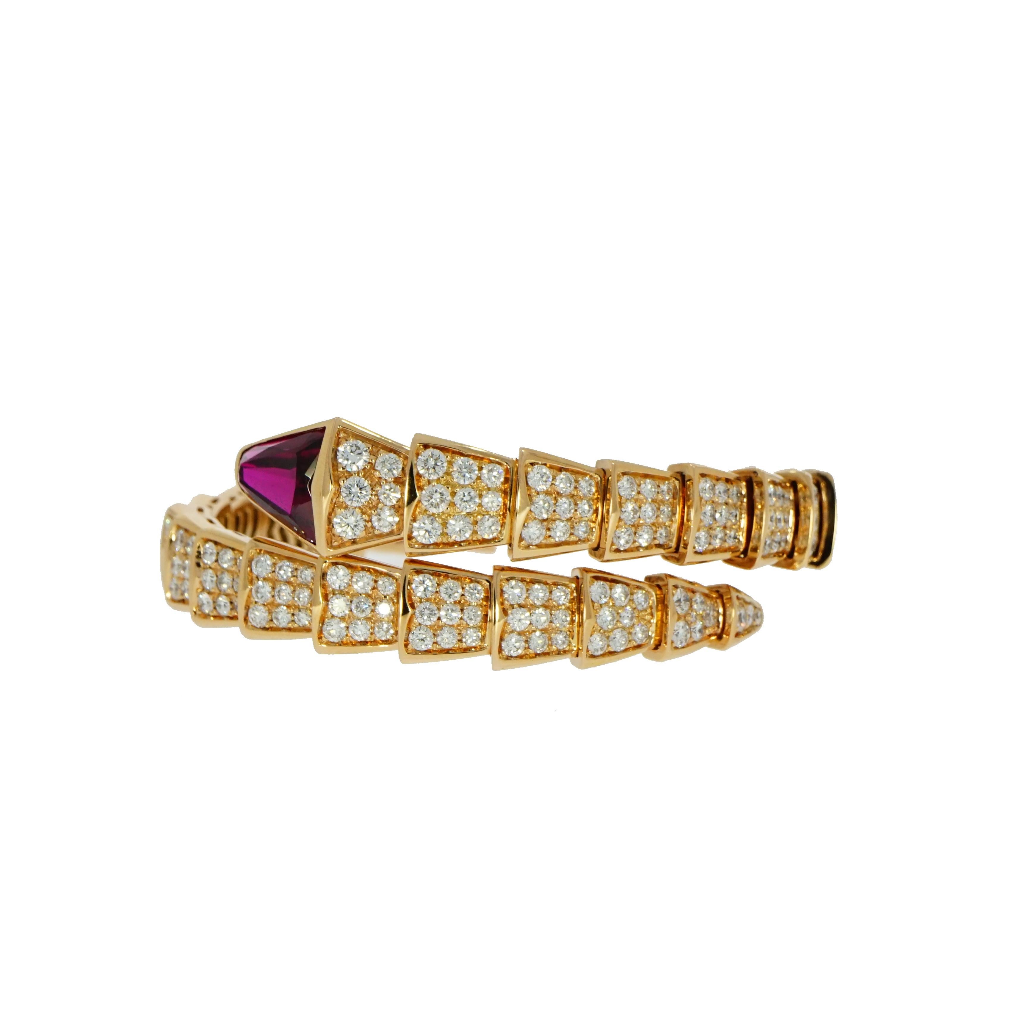 This impressive 18k rose gold Serpenti bracelet by Bvlgari, has a form of a serpent wrapping around the wrist, composed of 30 graduating flexible pave set intersections. Each intricate link is set with round brilliant cut diamonds alternating in