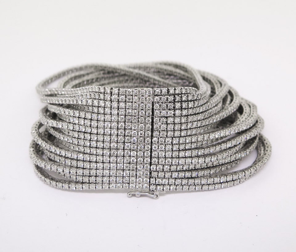 Spectacular 15 Strand Diamond Bracelet crafted in 18 Karat White Gold.  22.46 Carats of G color, VS clarity diamonds.  This bracelet is incredibly well crafted and comfortable to wear feeling like silk on the wrist!