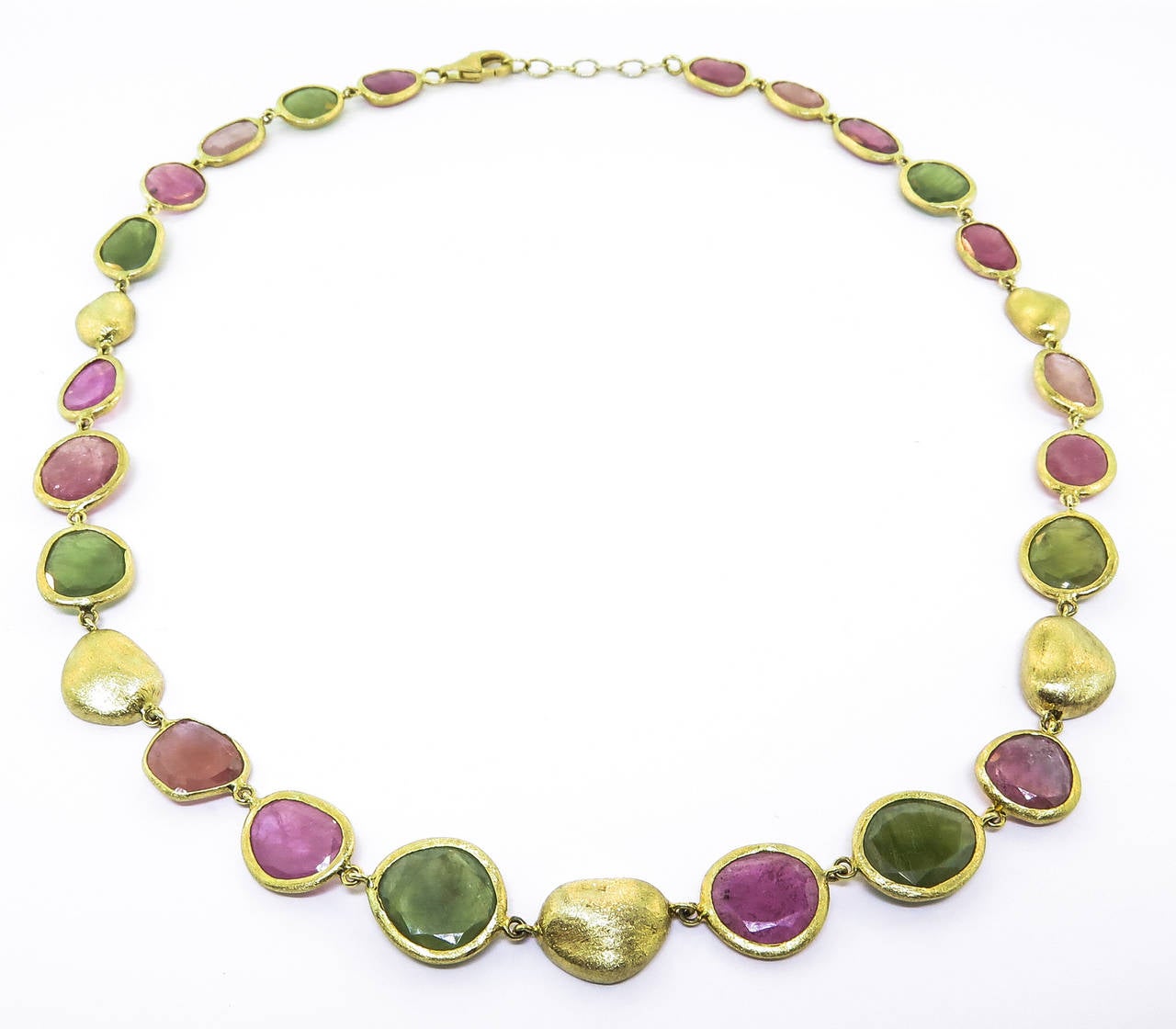 76 Carats of natural sapphire slices in vibrant colors shine in this beautiful necklace by Yvel.  Handcrafted in Israel, this necklace is a great addition to any ensemble!