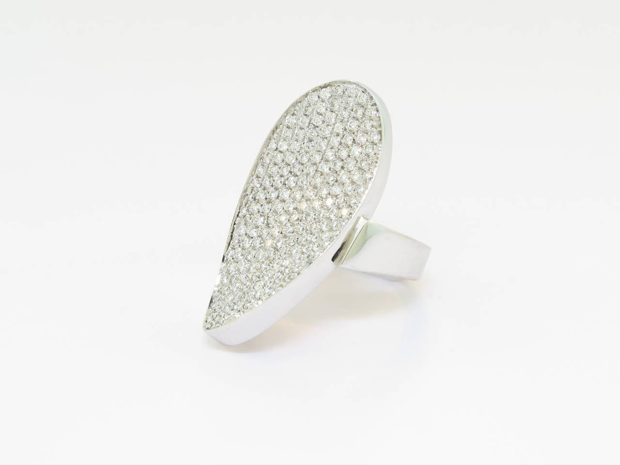 Fashion forward pave diamond feather ring crafted in 18 karat white gold.  This ring features 1.43 carats of pave set diamonds made in Italy by Mattioli.