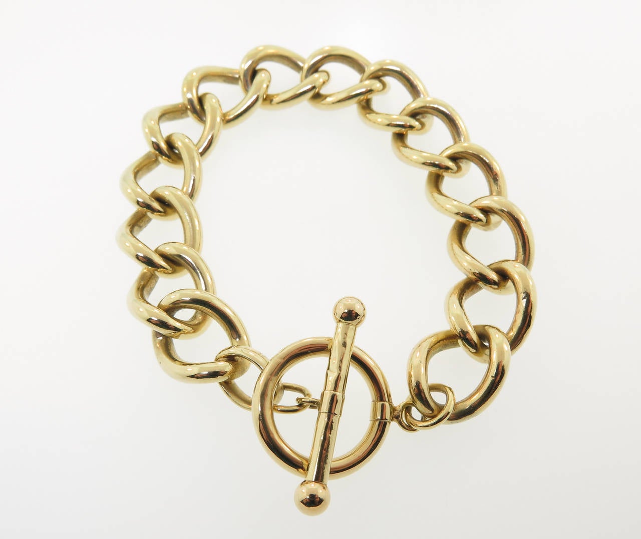 An Italian Classic iconic design bracelet is crafted out of 14k yellow gold with a toggle clasp.