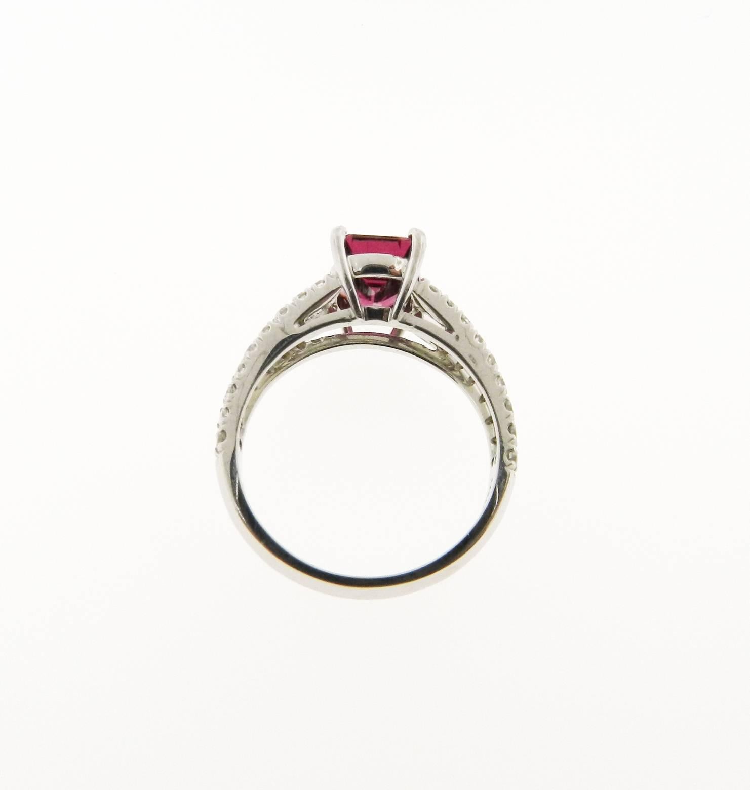 Beautiful ring, centering an emerald-cut pink tourmaline set in 18k white gold, flanked by two rows of prong-set round-cut diamonds, the weight of the pink tourmaline is approximately 1.66 carats.
Size 6.