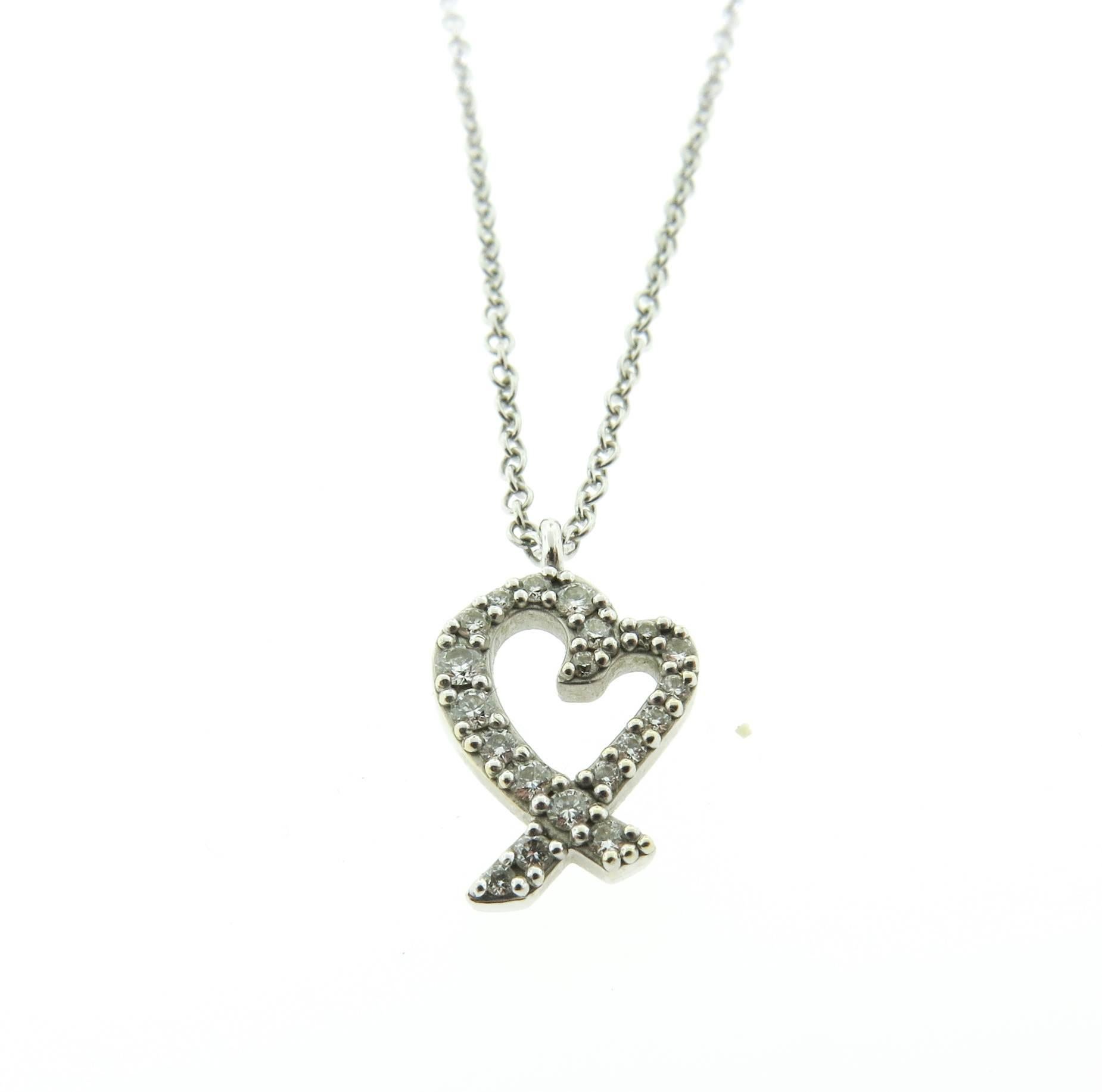 A timeless design by Paloma Picasso. This  beautiful necklace from Tiffany & Co. Loving Heart collection is made in 18k white gold and completed with pavé diamonds estimated 0.15 carats.  16” Chain. Original Tiffany & Co. Pendant Box Included.