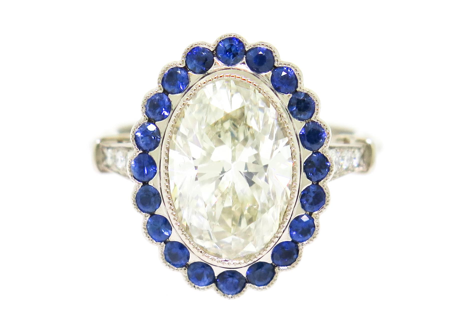 Retro 3.37 Carat Oval Diamond with Sapphire Halo White Gold Ring