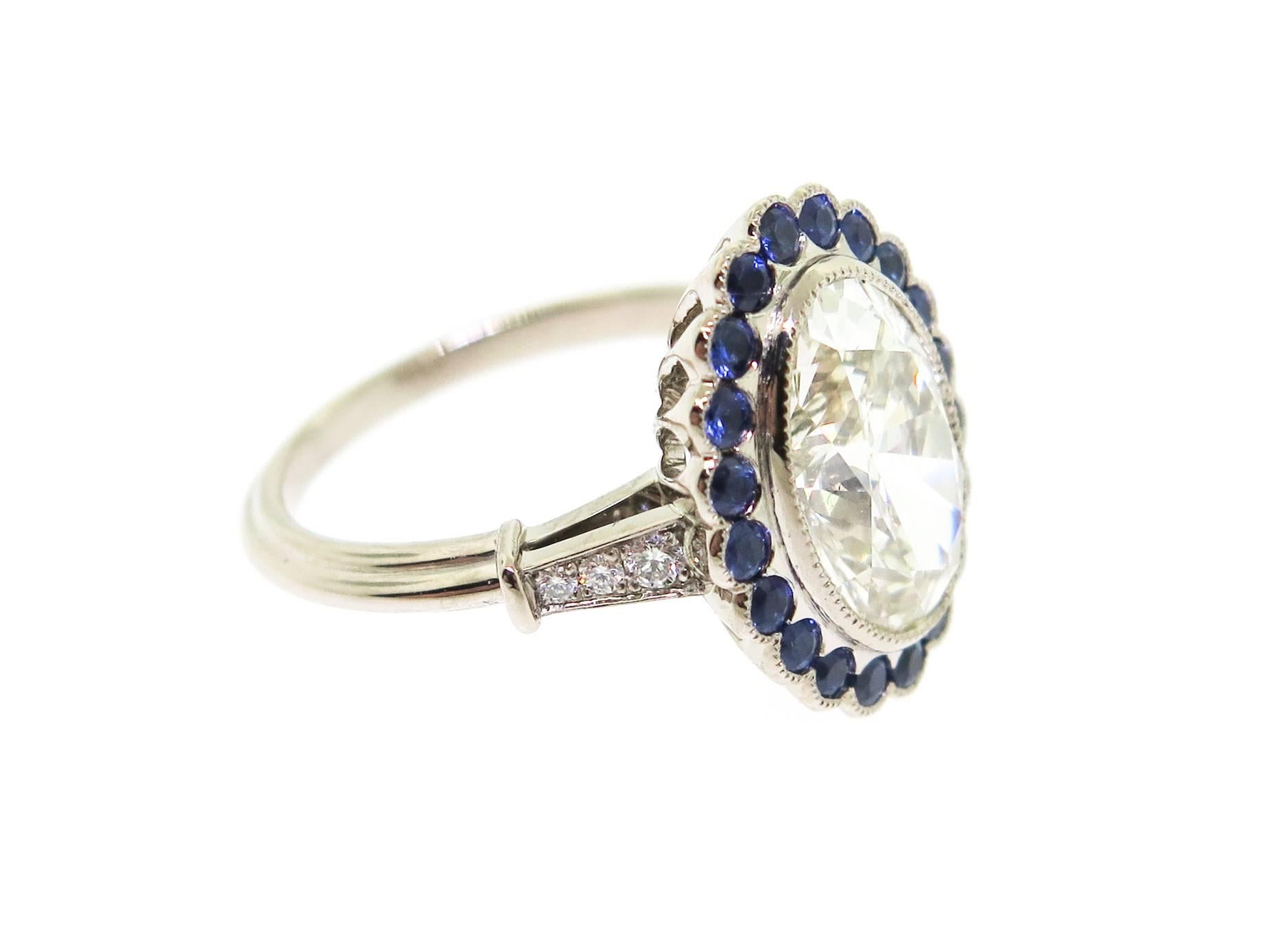 diamond ring surrounded by sapphires