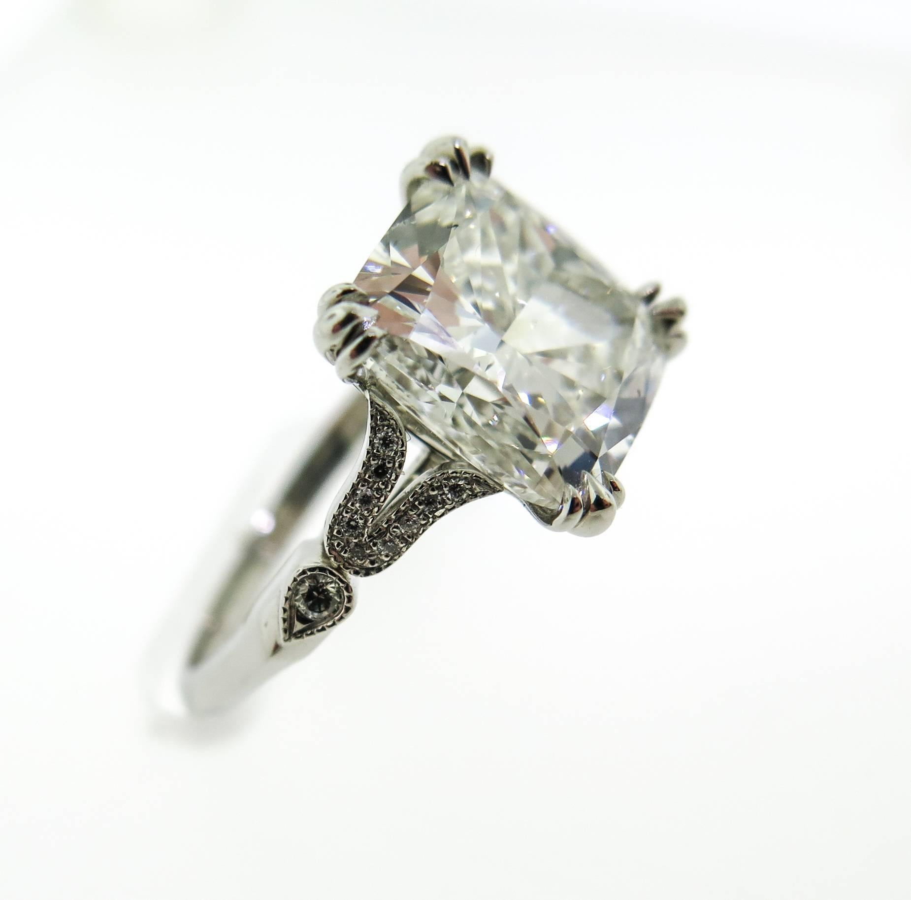 This extraordinary cushion cut diamond vintage inspired diamond engagement ring looks stunning. Weighing 5.02 carats, G color, SI1 clarity, it is absolutely out of this world and will instantly take your breathe away! Hand made and mounted in