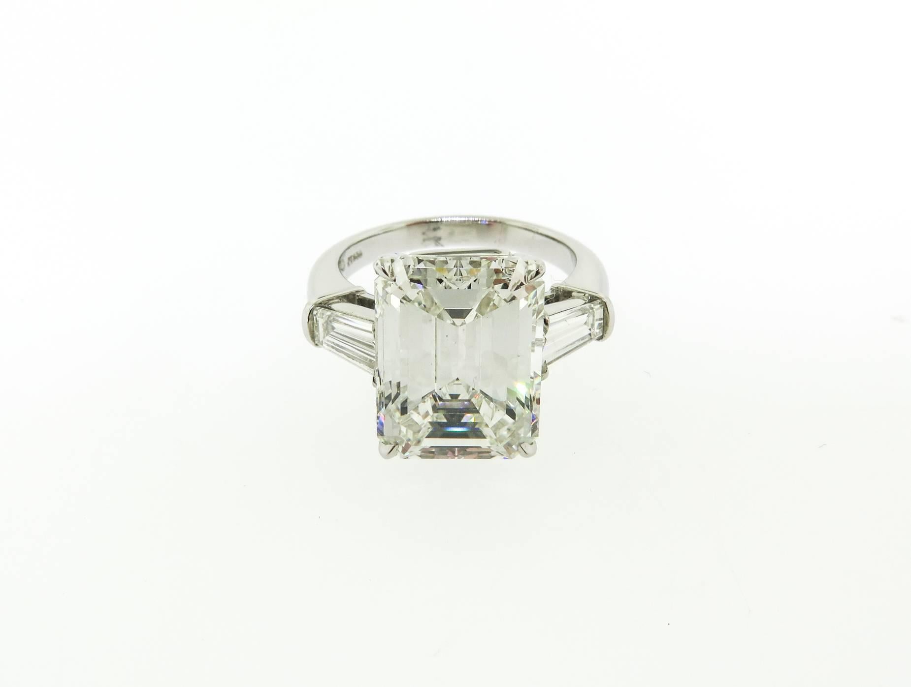 This gorgeous handmade platinum ring features a GIA certified 7.47 ct, I color, VS2 clarity, emerald cut with tapered baguettes. This stunning engagement ring is the perfect choice for your true love!