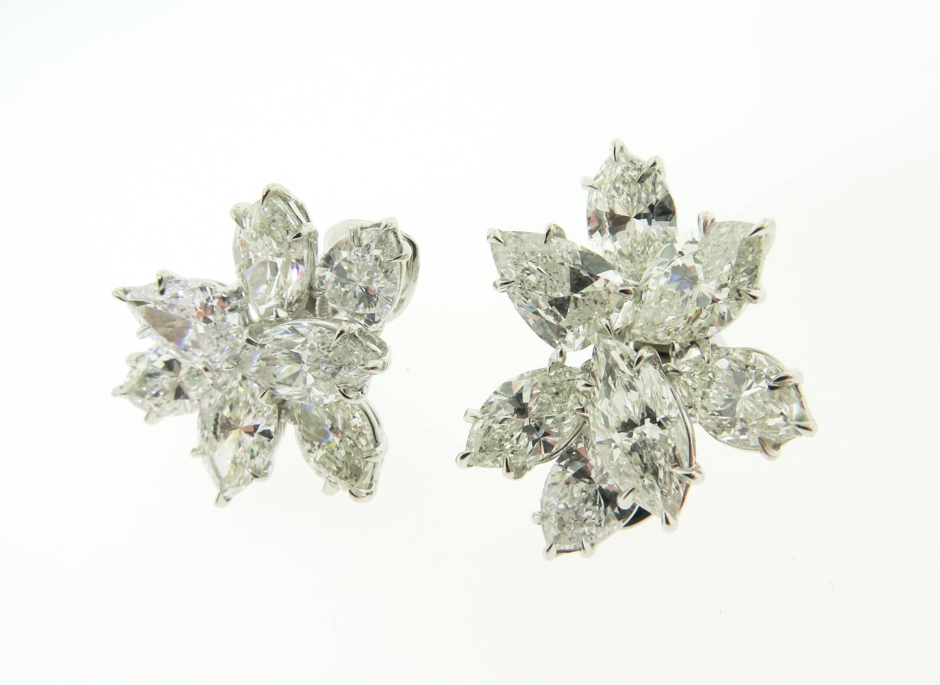 This gorgeous pair of earrings is set with 4 pear shape and 10 marquise diamonds G color, VS clarity. Total diamond weight is 13.43 carats. Diamond weight ranges from 0.90ct to 1.19ct each. Set in platinum. Please call us for more details.
