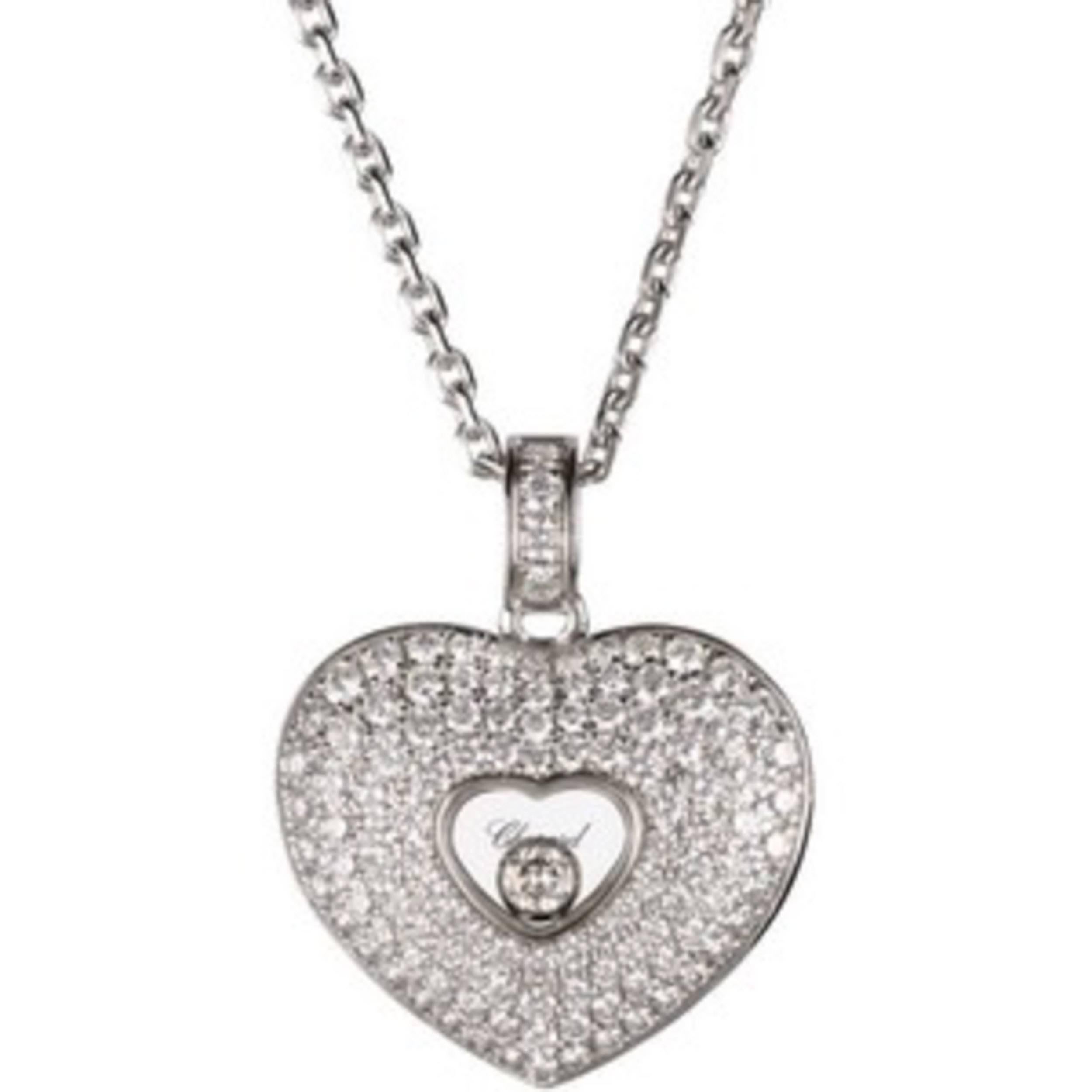 Truly beautiful Diamond Pave Heart Pendant by Chopard. Happy Diamonds collection, combining the feminine style with jewelry excellence. This heart-shaped pendant in 18k white gold is pave set with 113 diamonds and a single bezel set diamond
