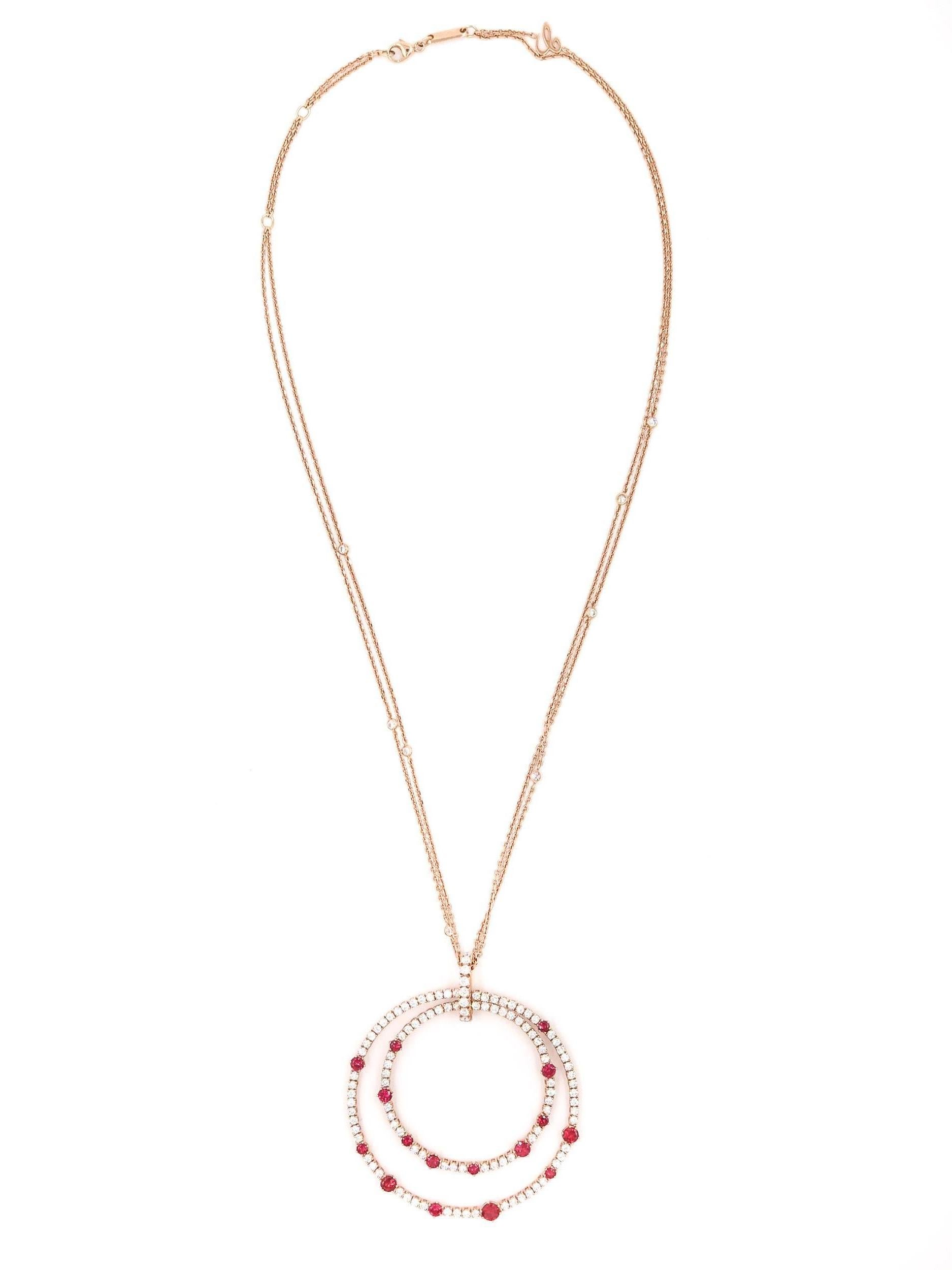 The exceptional beauty and elegance of the diamonds with vibrant rubies leaves no wish for sparkles unfulfilled. 
The tenderness of the 18 karat rose gold with its graceful curves makes this necklace a perfect complement to her style.
L'Heure du