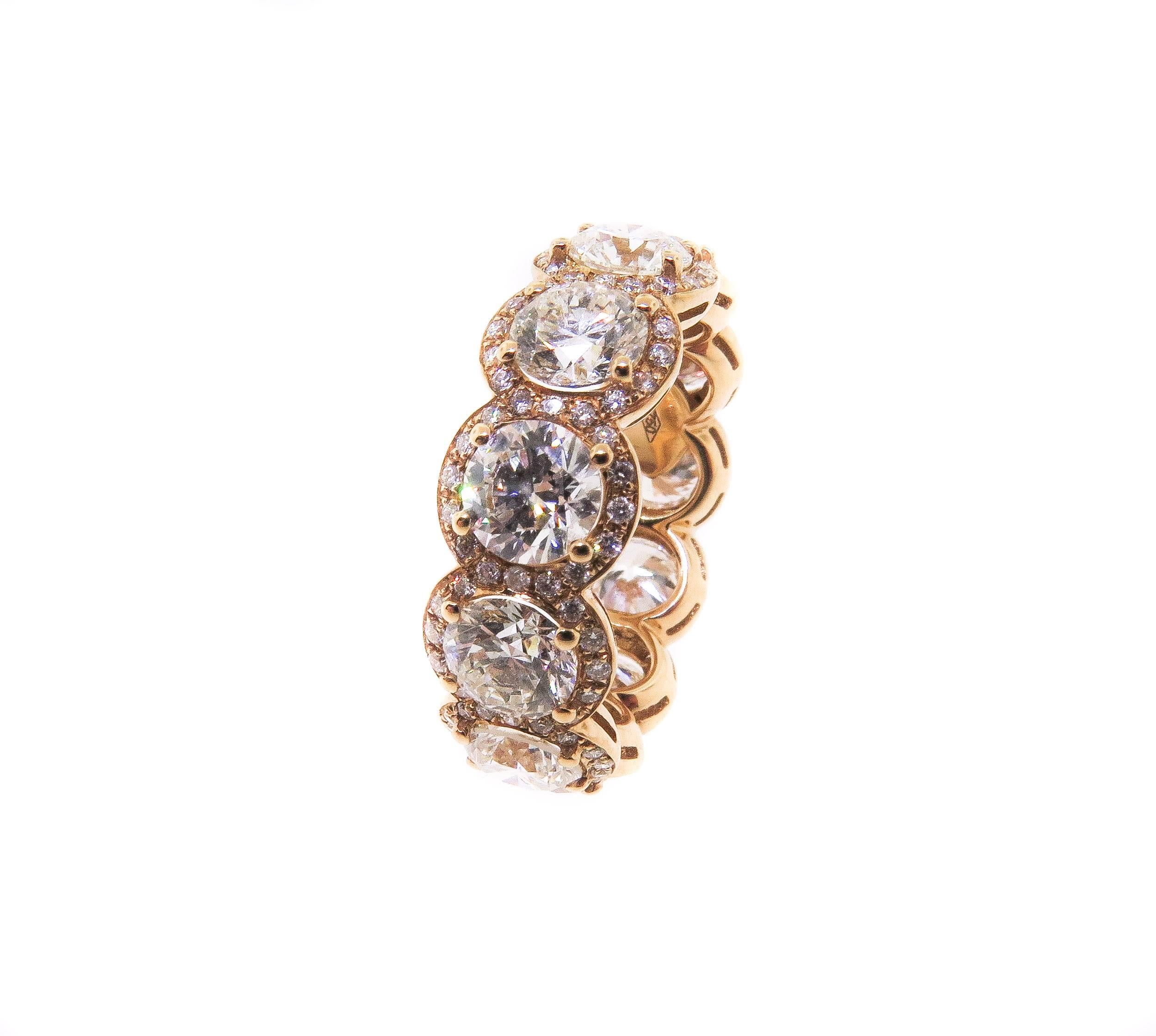 Be prepared for a flood of compliments on this eye catching ring that you won’t see on anybody else’s finger.
This stunning diamond band is handcrafted in 18K rose gold and contains 13 perfectly matched round brilliant cut diamonds weighing