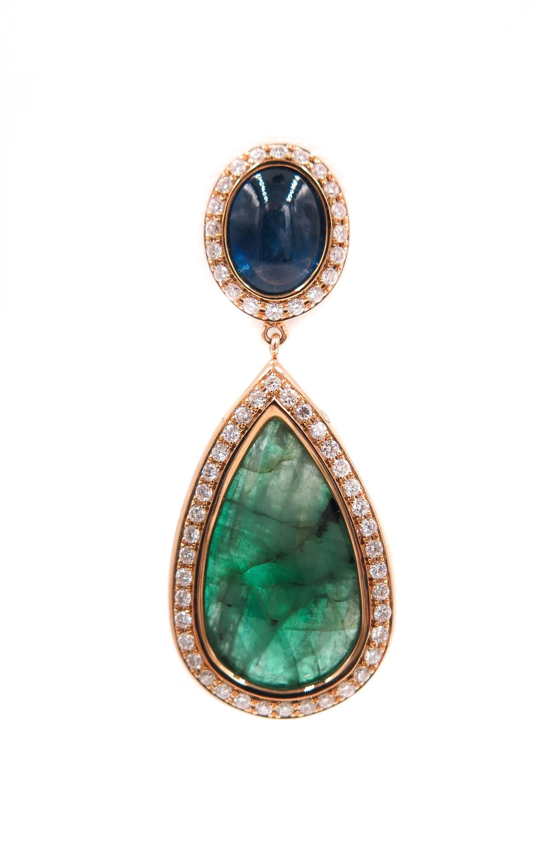 Exotic and Contemporary Drop Earrings.
Created by the Portuguese designer Monseo, revealing the essence and timeless beauty of the Emerald and Sapphire.  
This unique pair of earrings are handcrafted in 19K yellow gold and surrounded by 116 white