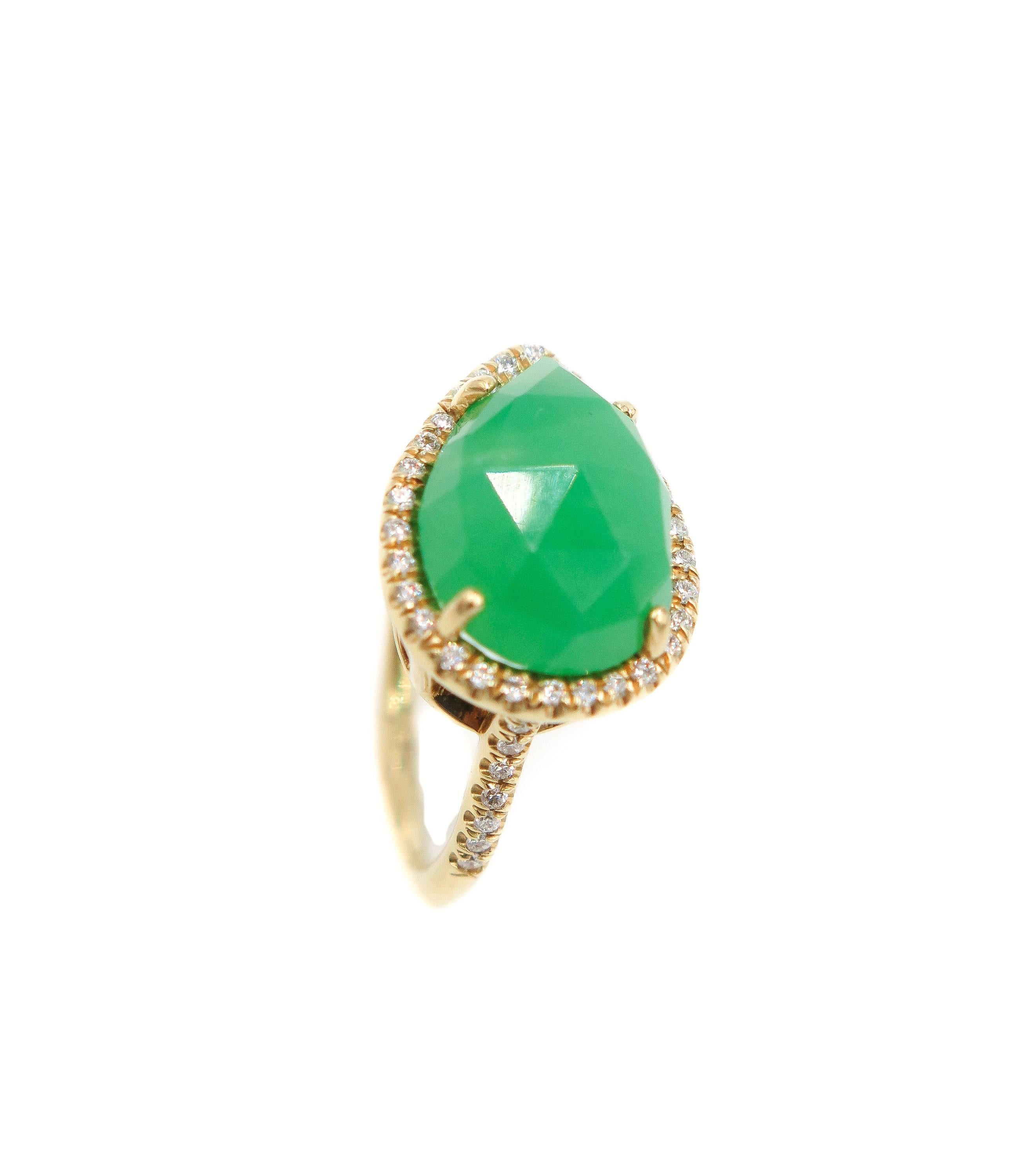 A ring that is feminine, but with a bit of an edge, innovative, yet on trend with the latest fashions. 
This “bohemian chic” ring is designed to feature a pear shaped apple green chrysoprase surrounded by white round cut diamonds.
Created in NYC by