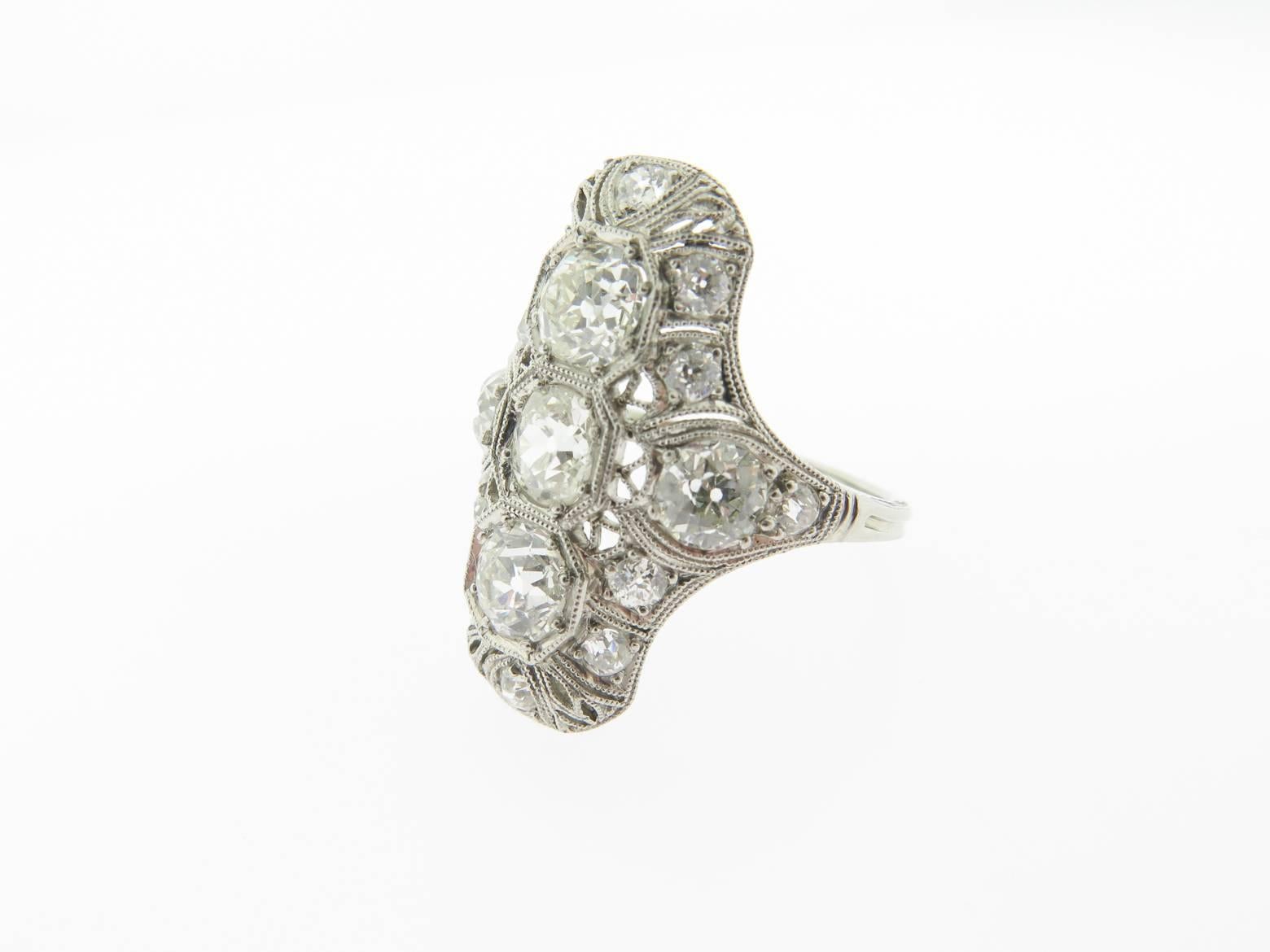 Magnificent ring, 18k white gold with 3 old mine cut round diamonds 0.55ct each. 2 diamonds at side 0.70ct and 10 diamonds of 0.10ct each. Total diamonds weight is 3.55ct G/H color, VS2 clarity. Size 7