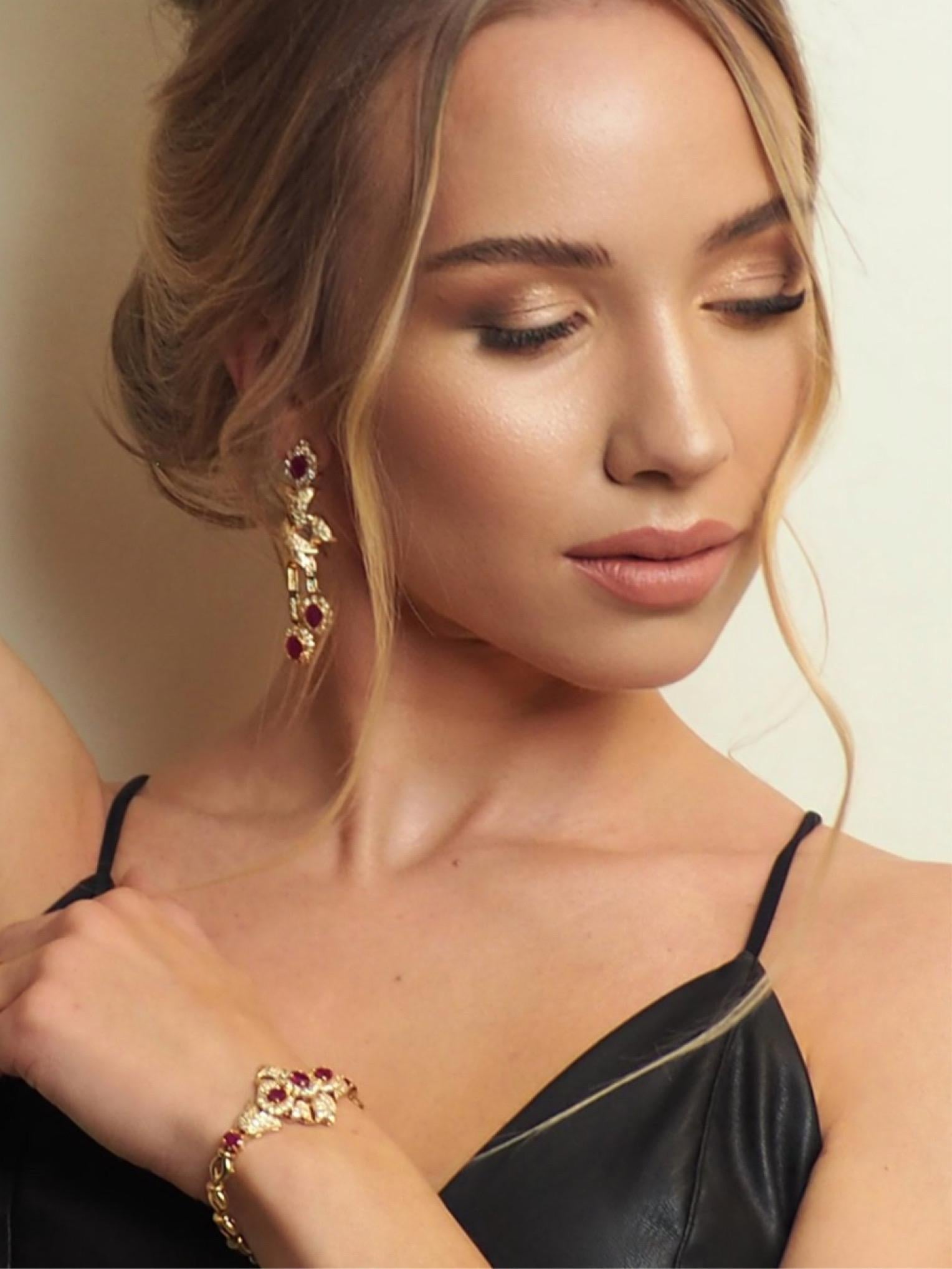 Indulge in luxury with this sophisticated and timeless set of bracelet and earrings crafted in exquisite 18K yellow gold. You'll make heads turn with the stunning bracelet, elegantly paved with brilliant-cut diamonds and rubies totaling a remarkable
