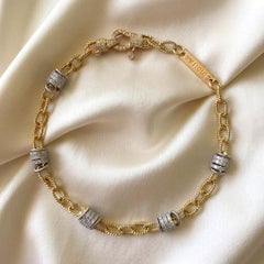 Pulsera Vitolo de oro bicolor de 18 quilates con eslabones retorcidos y rondelles de diamantes