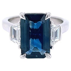 4.10 Carat Emerald Cut Teal Sapphire and Diamond Three-Stone Ring in Platinum