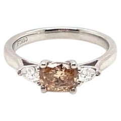 0.63 Carat Oval Shaped Fancy Diamond with Two Pear Diamonds set in Platinum