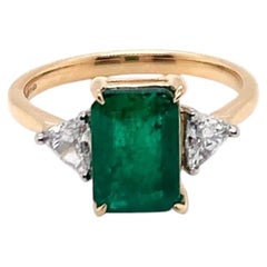 1.78 Carat Emerald and Diamond Three-stone Ring in 18K Yellow Gold and Platinum